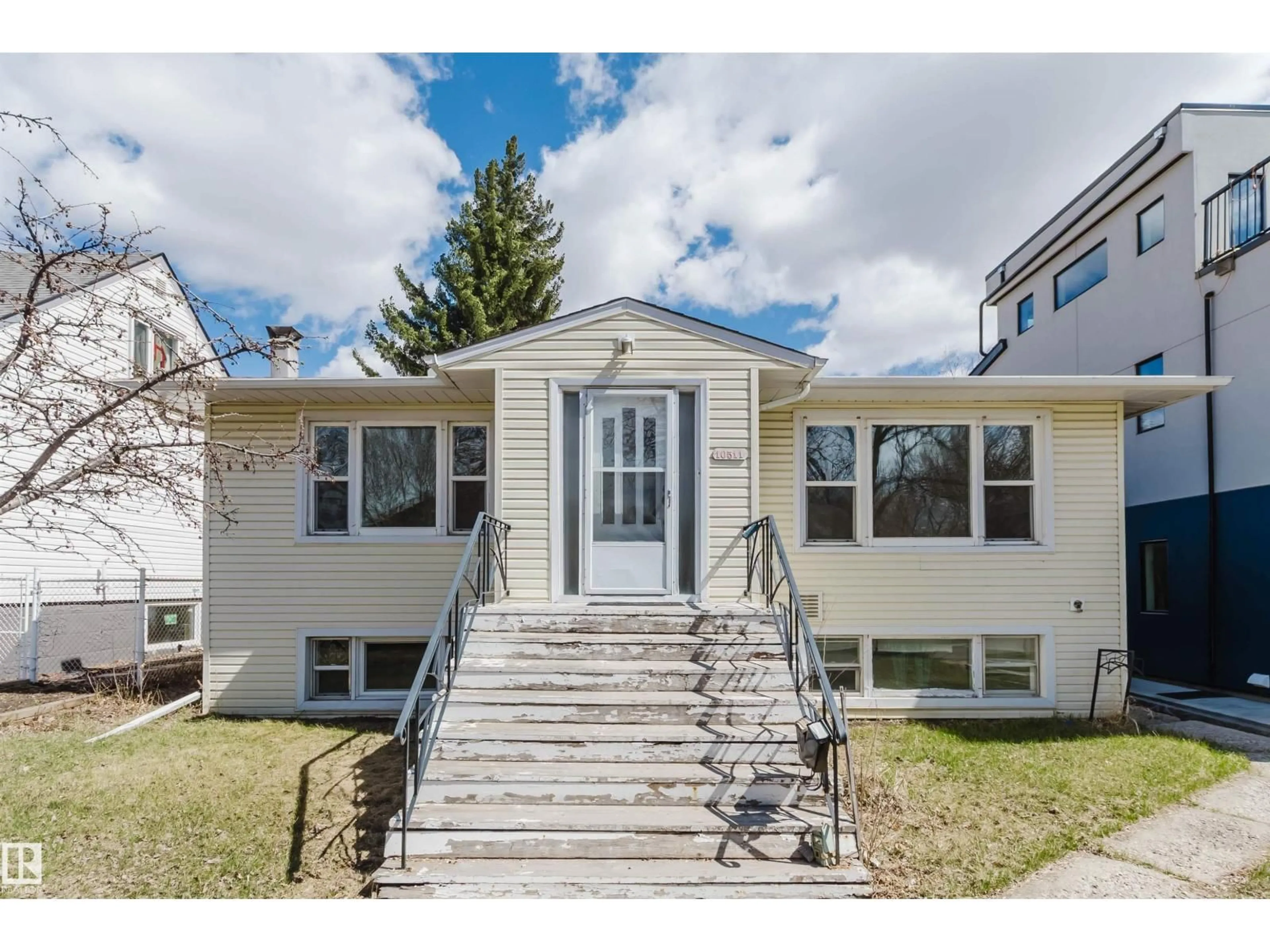Home with vinyl exterior material, street for 10511 80 ST, Edmonton Alberta T6A3J8