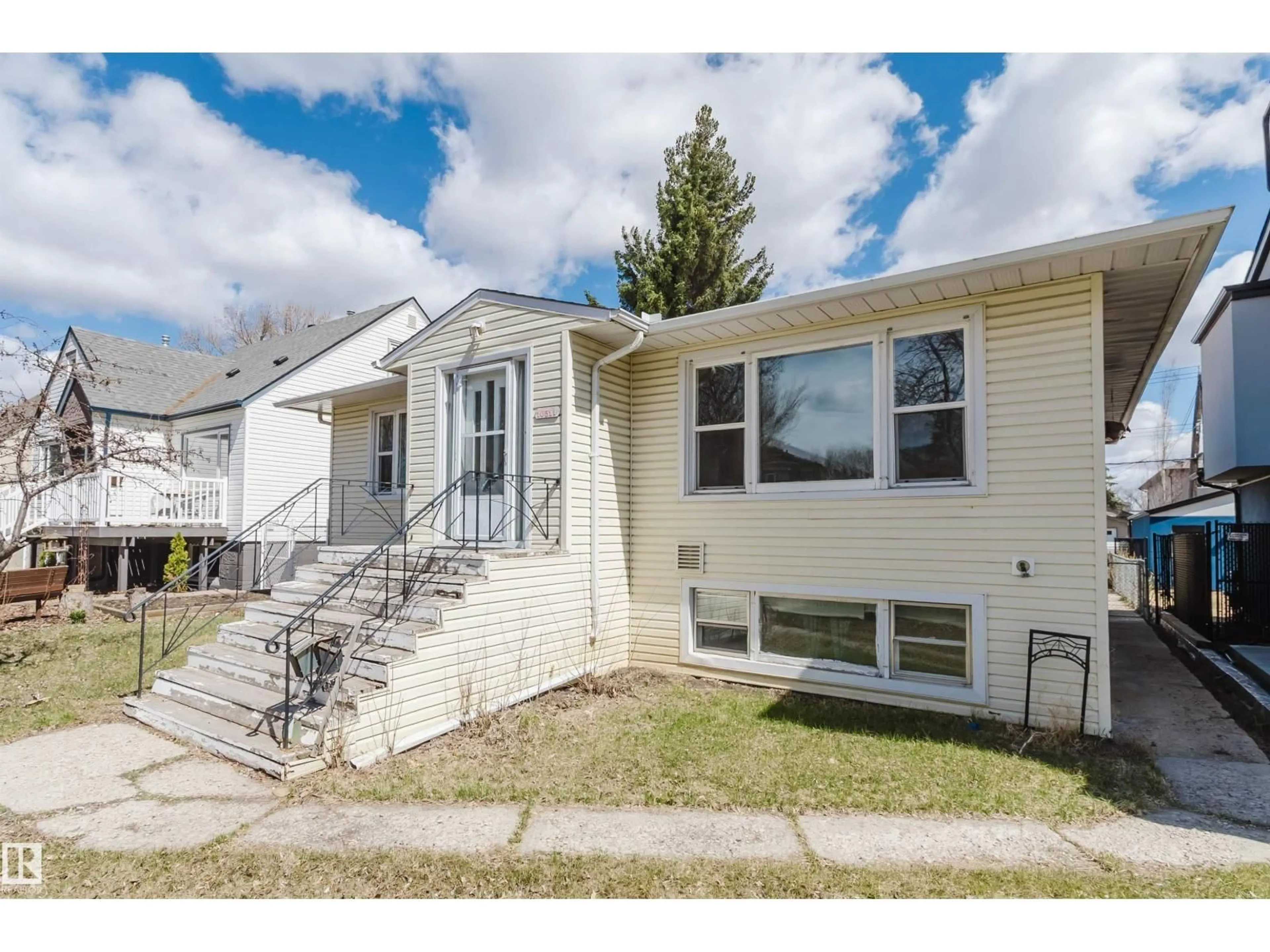 Home with vinyl exterior material, street for 10511 80 ST, Edmonton Alberta T6A3J8