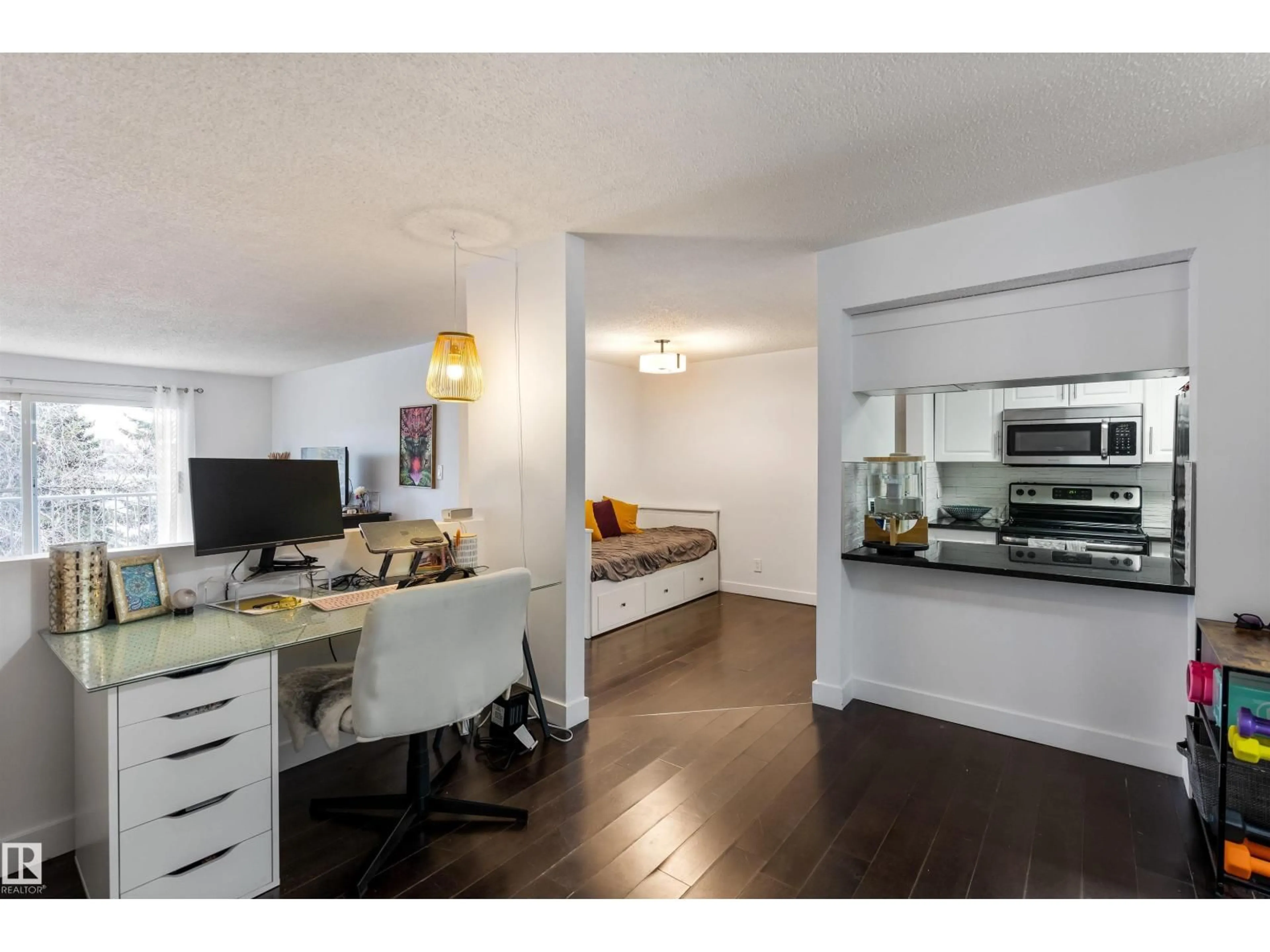 Open concept kitchen, wood/laminate floor for #403 - 10335 118 ST, Edmonton Alberta T5K1Y6