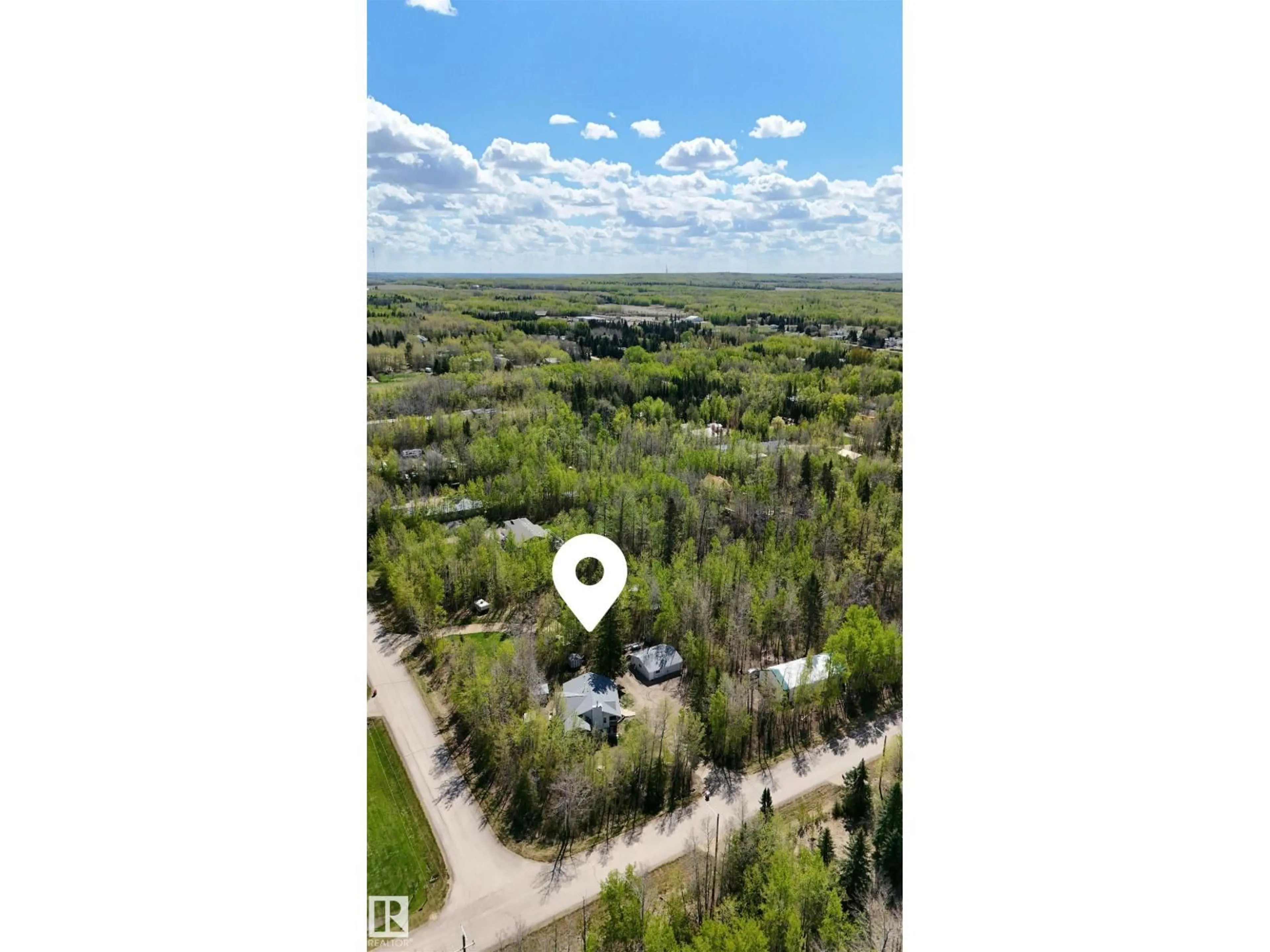 A pic from outside/outdoor area/front of a property/back of a property/a pic from drone, forest/trees view for 5502 39 ST, Rural Wetaskiwin County Alberta T0C2C0