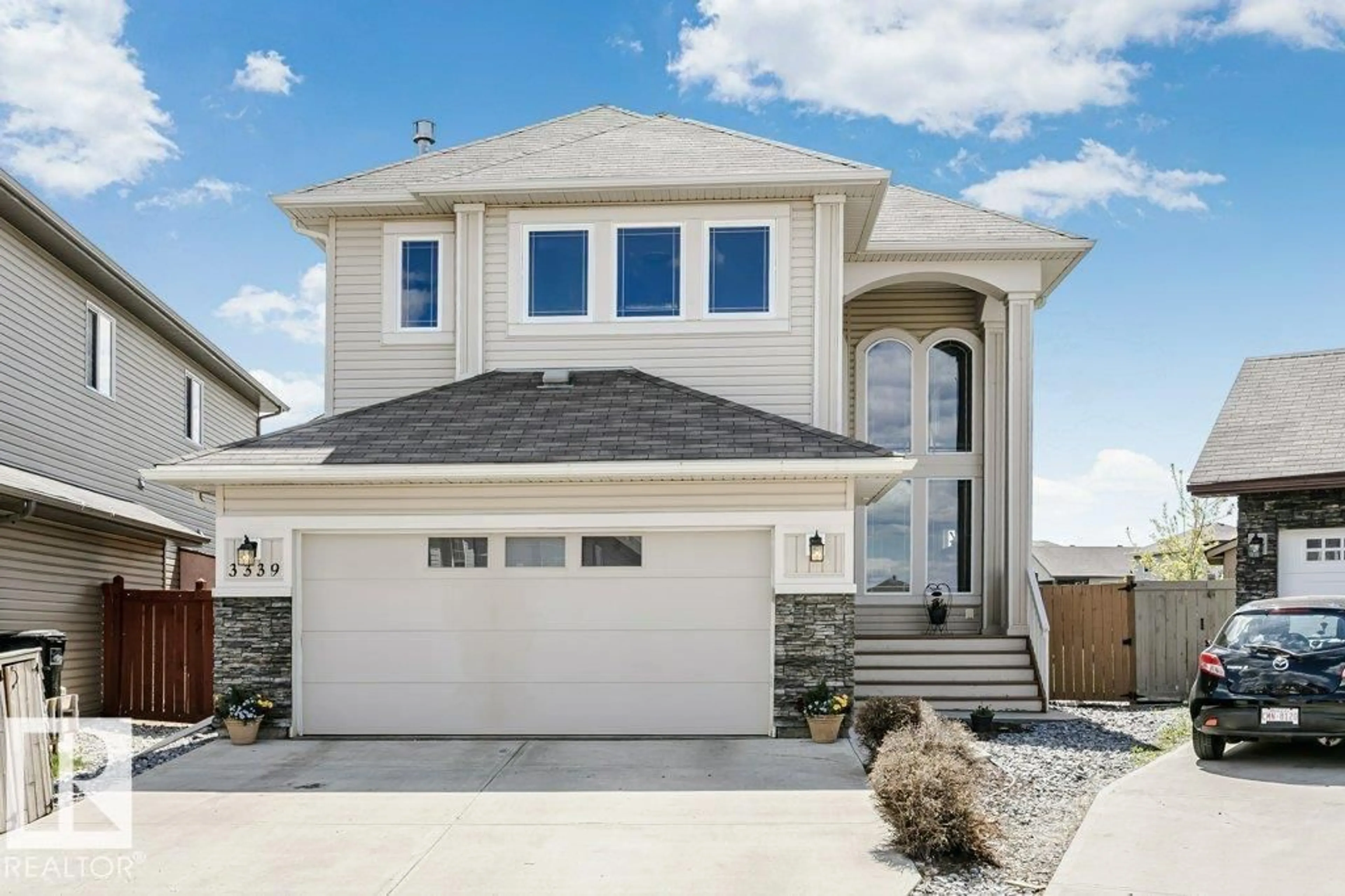 Home with vinyl exterior material, street for 3339 21 AV, Edmonton Alberta T6T0L1