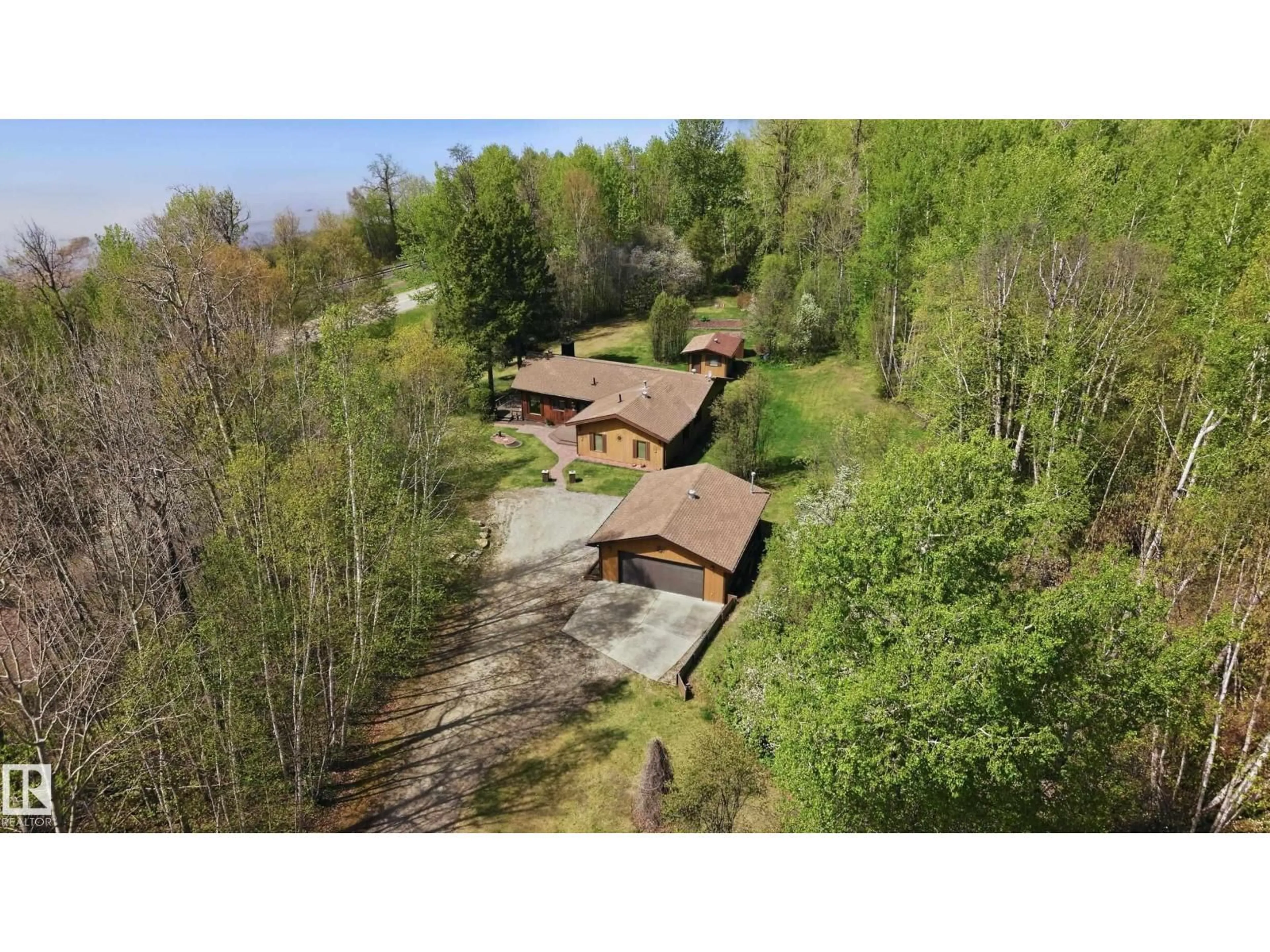 A pic from outside/outdoor area/front of a property/back of a property/a pic from drone, forest/trees view for 4502 A LAKESHORE RD, Wabamun Alberta T0E2K0