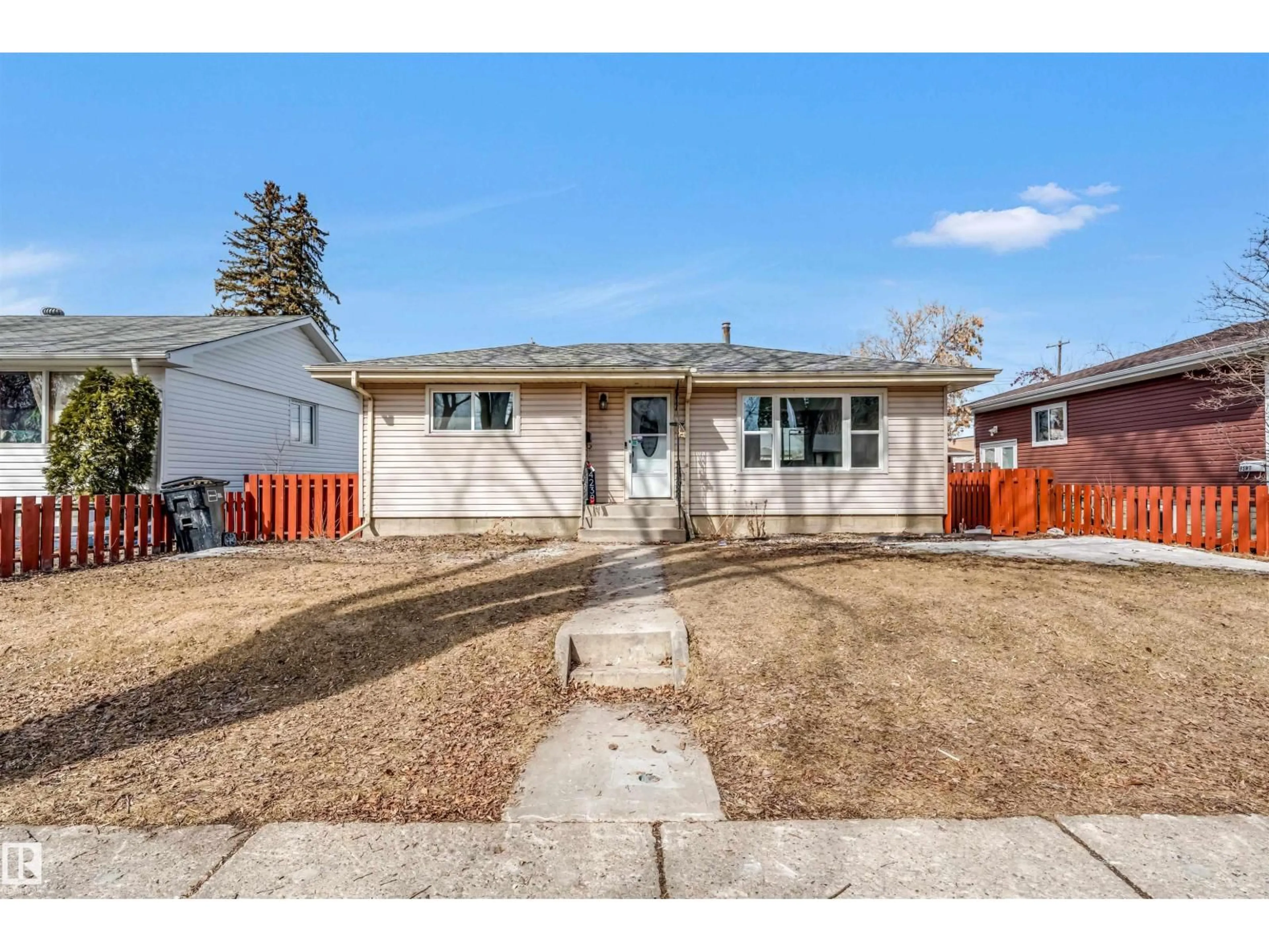 Home with vinyl exterior material, street for NW - 4238 117 AV, Edmonton Alberta T5W0Y4