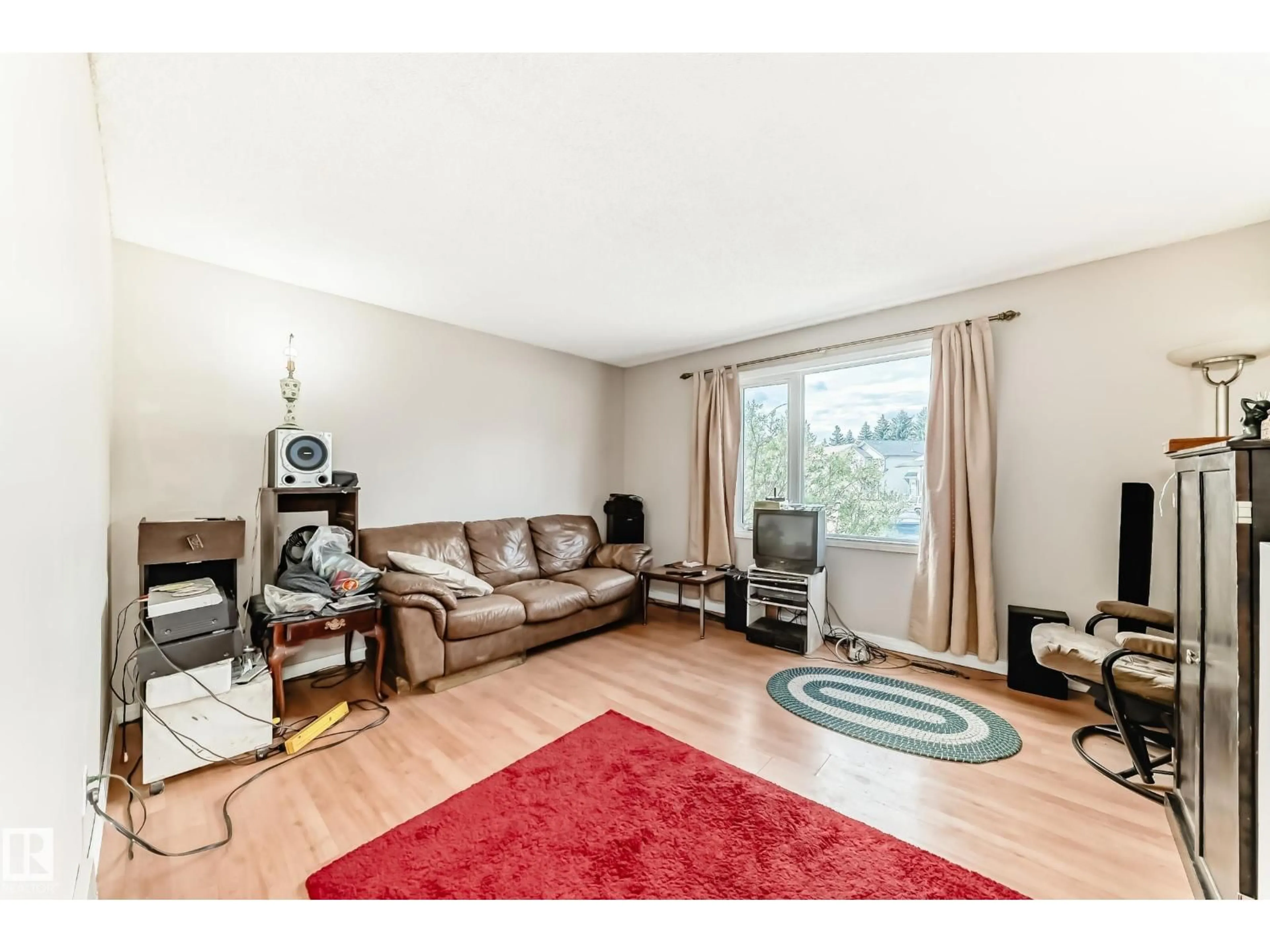 Living room with furniture, unknown for 10603 98 AV, Morinville Alberta T8R1E4