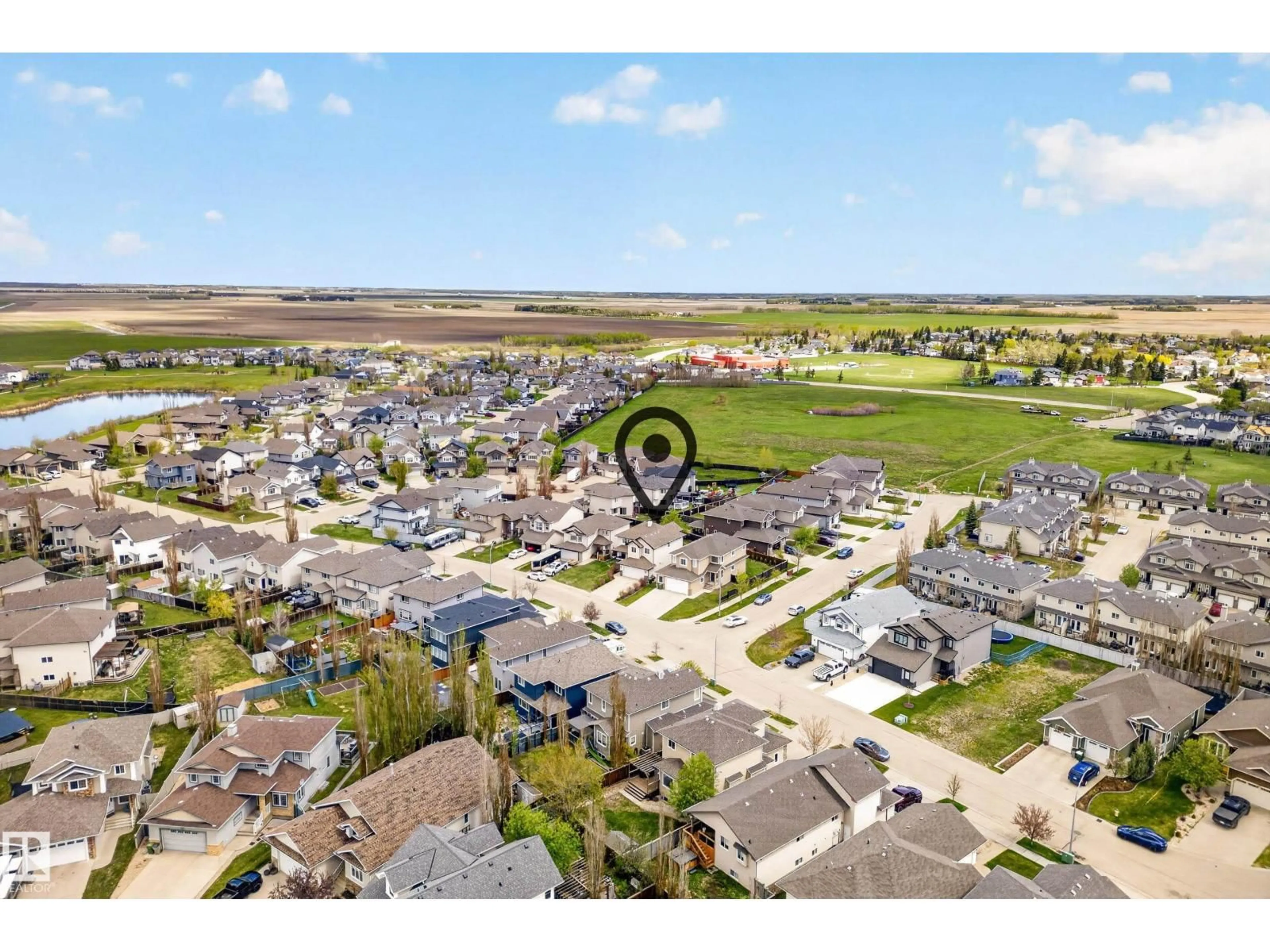 A pic from outside/outdoor area/front of a property/back of a property/a pic from drone, water/lake/river/ocean view for 10203 96 ST, Morinville Alberta T8R0B5