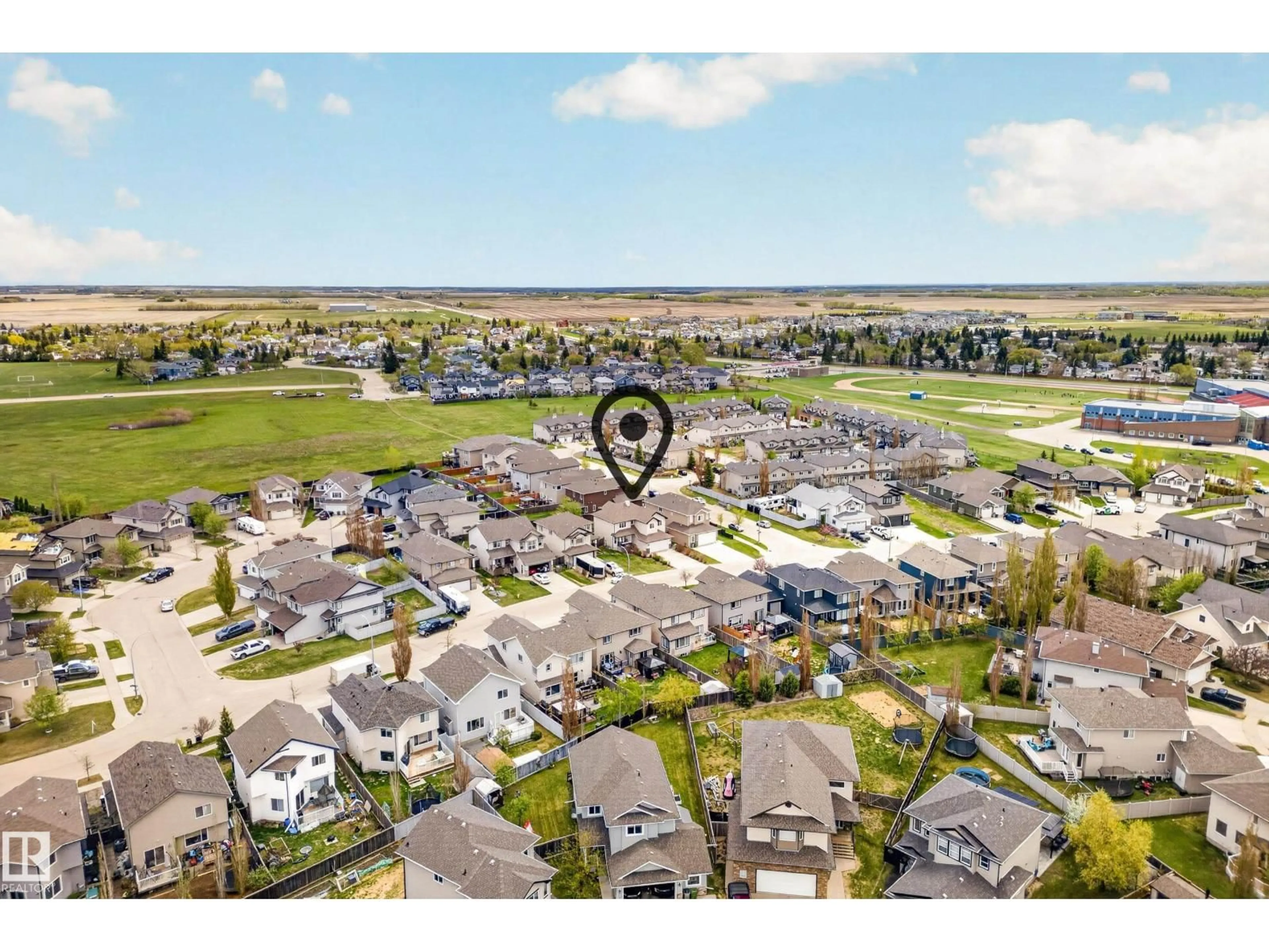 A pic from outside/outdoor area/front of a property/back of a property/a pic from drone, water/lake/river/ocean view for 10203 96 ST, Morinville Alberta T8R0B5