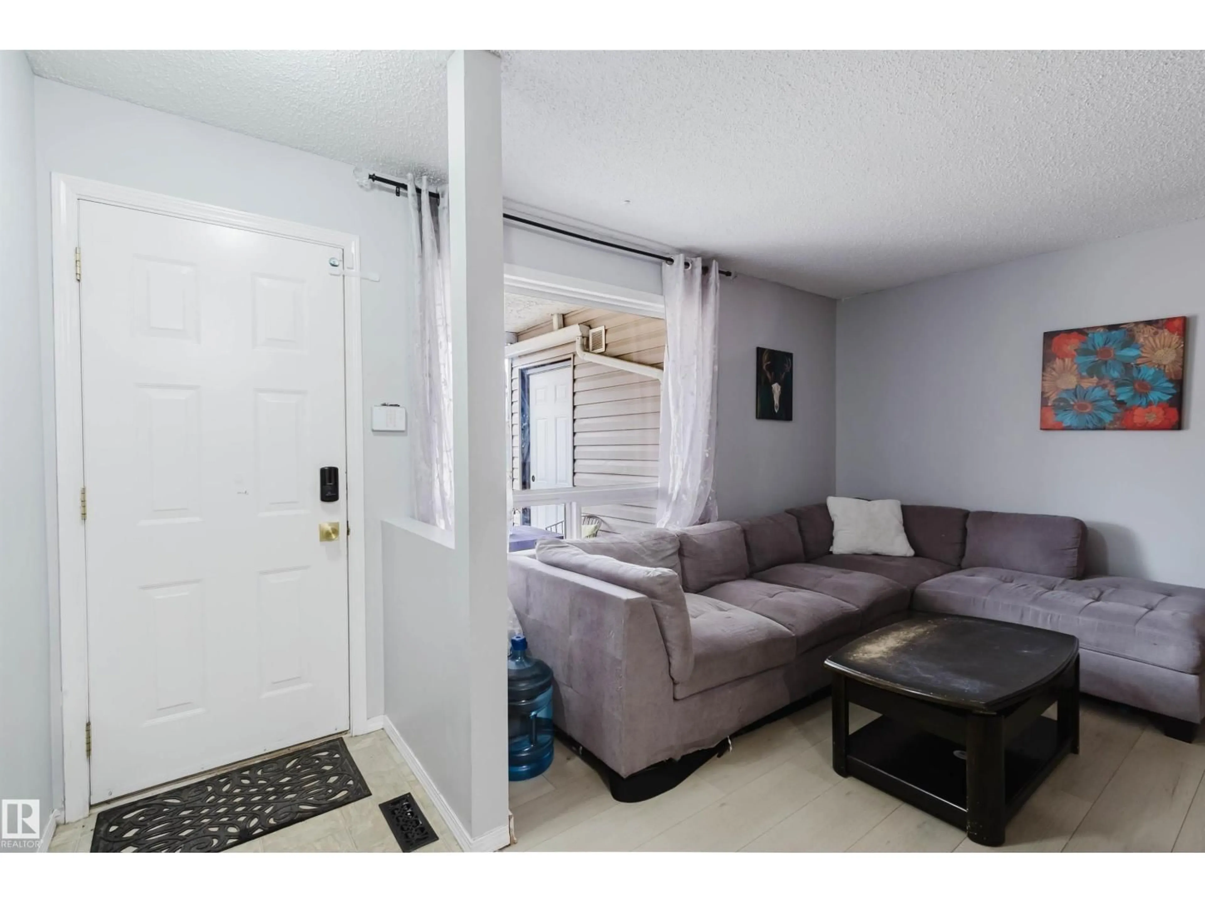 Living room with furniture, unknown for 15017 26 ST, Edmonton Alberta T5Y2G6