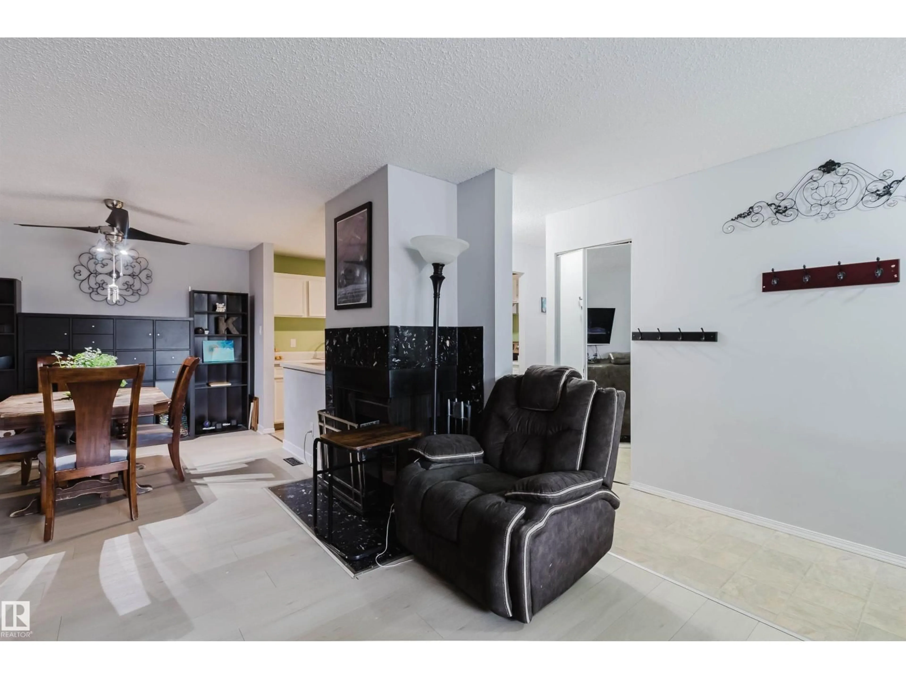 Living room with furniture, ceramic/tile floor for 15017 26 ST, Edmonton Alberta T5Y2G6