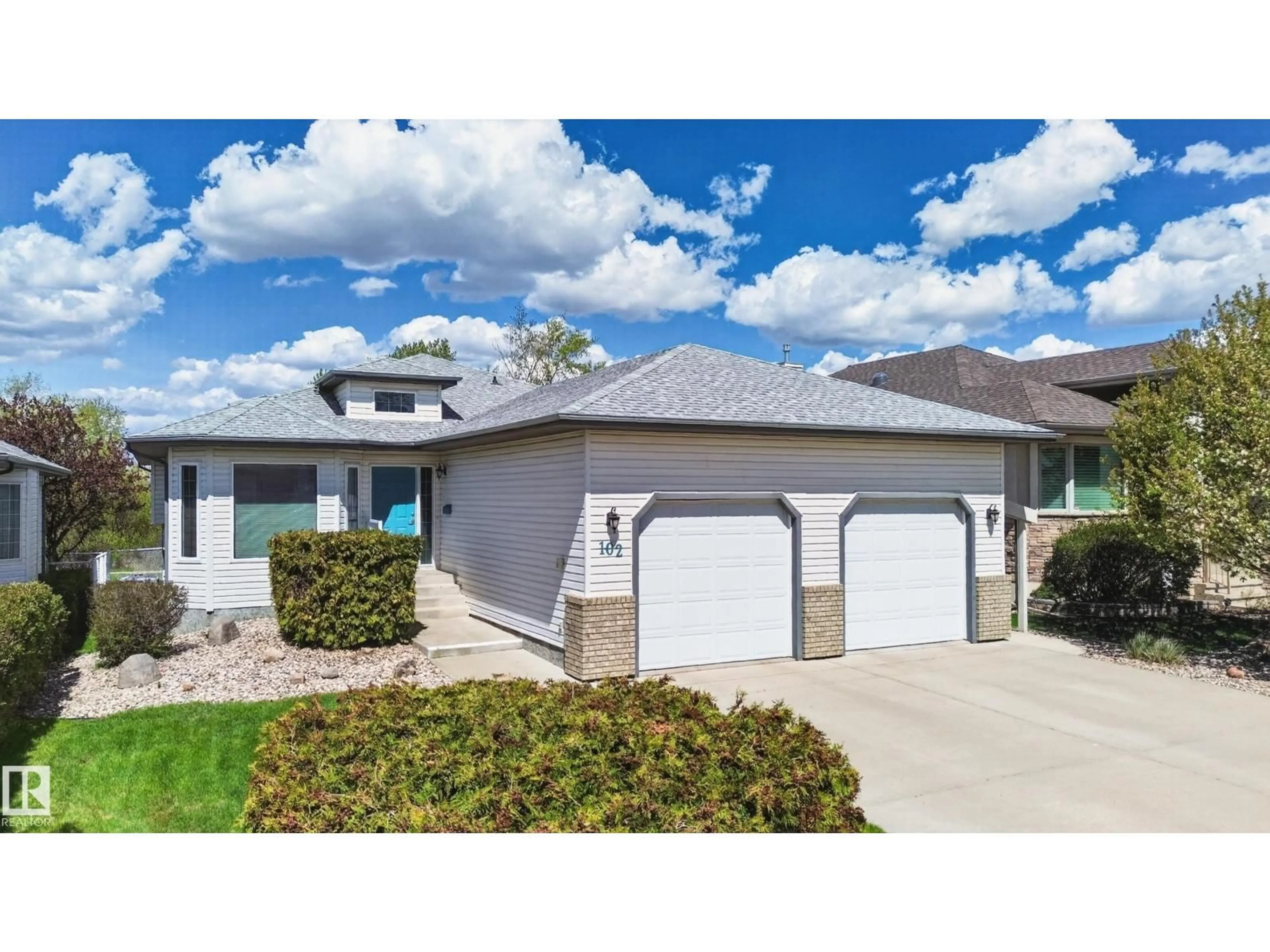 Home with vinyl exterior material, street for 102 BRIDGEVIEW DR, Fort Saskatchewan Alberta T8L4J4