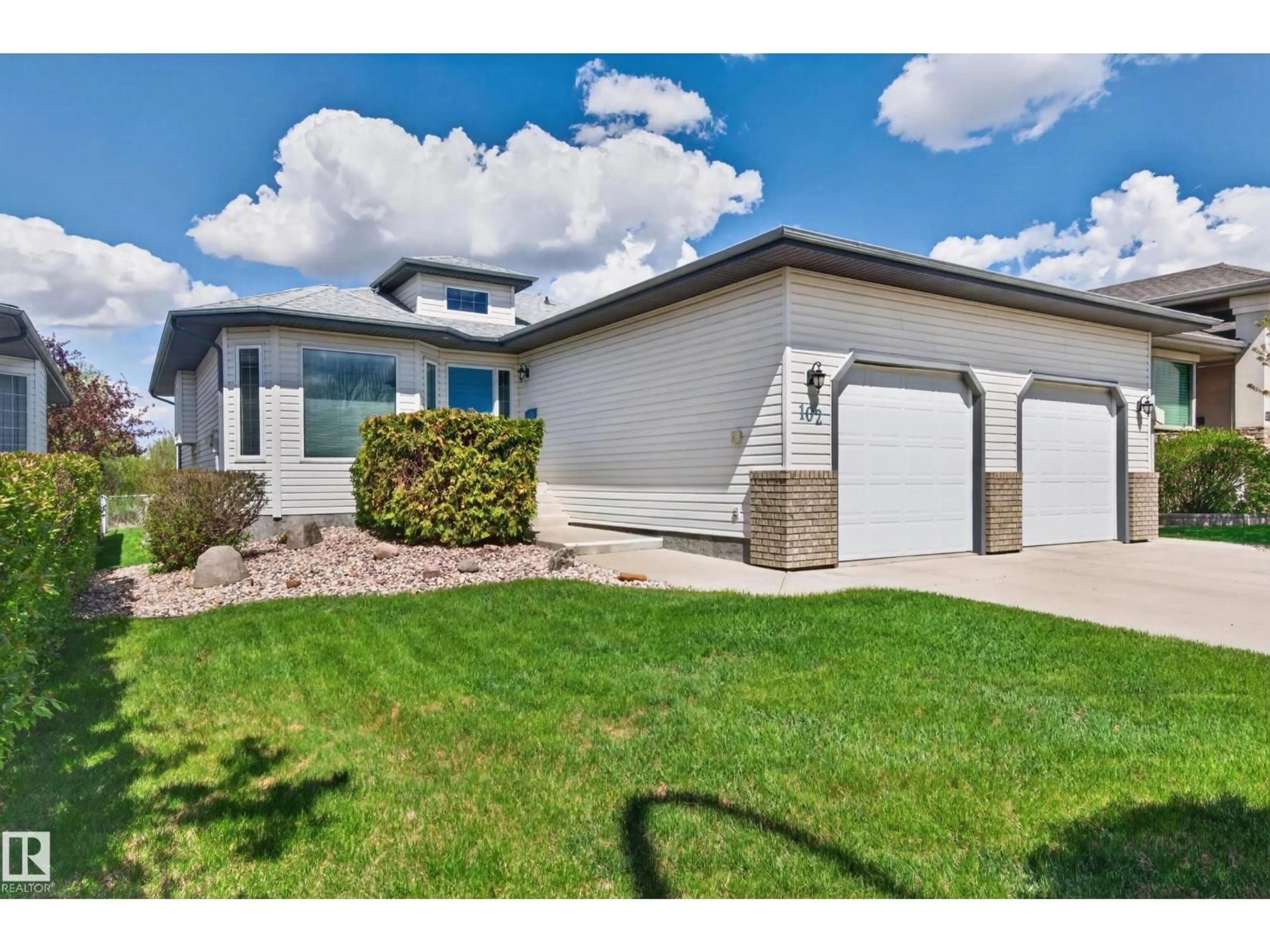 Home with vinyl exterior material, street for 102 BRIDGEVIEW DR, Fort Saskatchewan Alberta T8L4J4