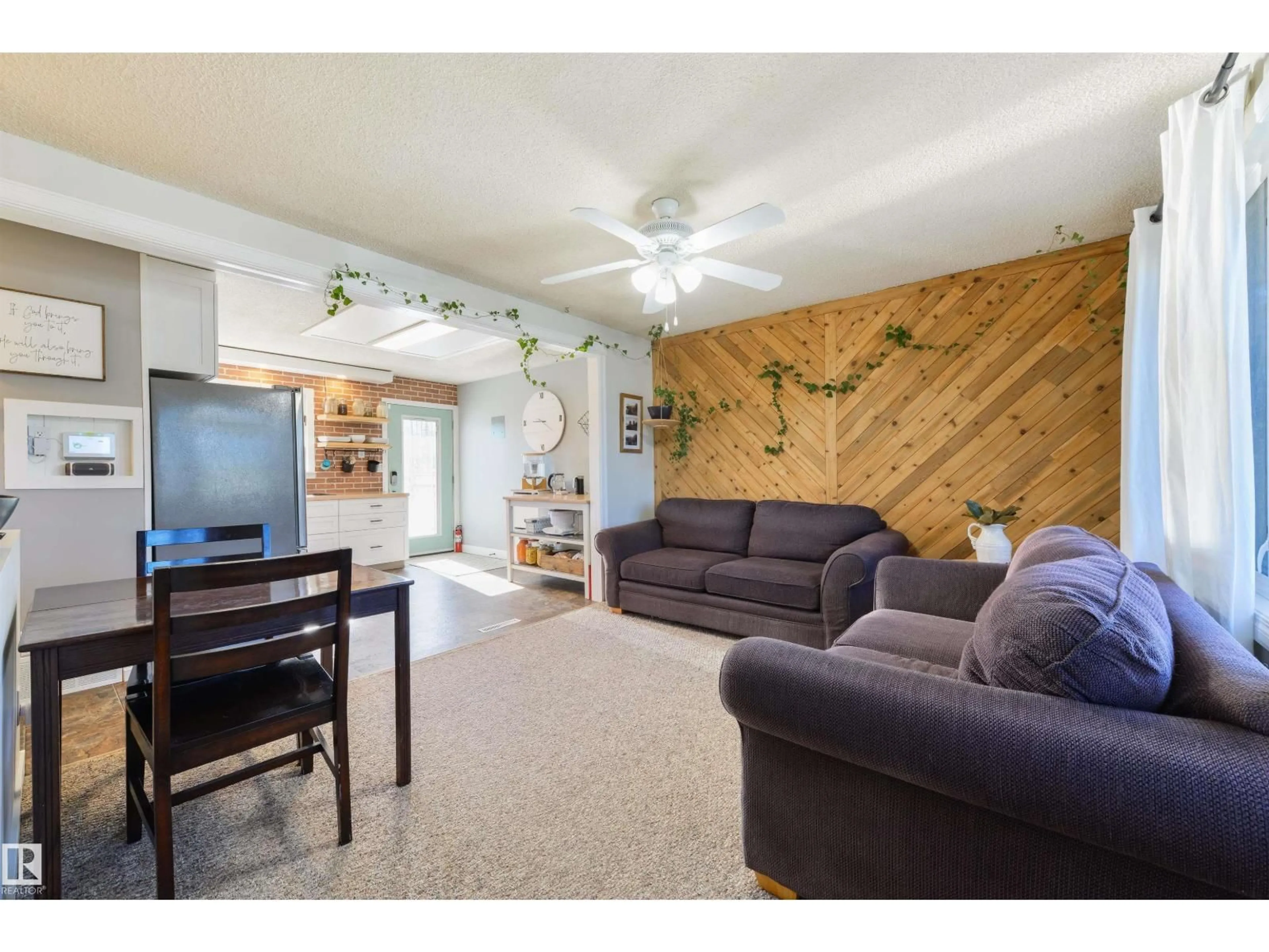 Living room with furniture, wood/laminate floor for NW - 12925 87 ST, Edmonton Alberta T5E3E2