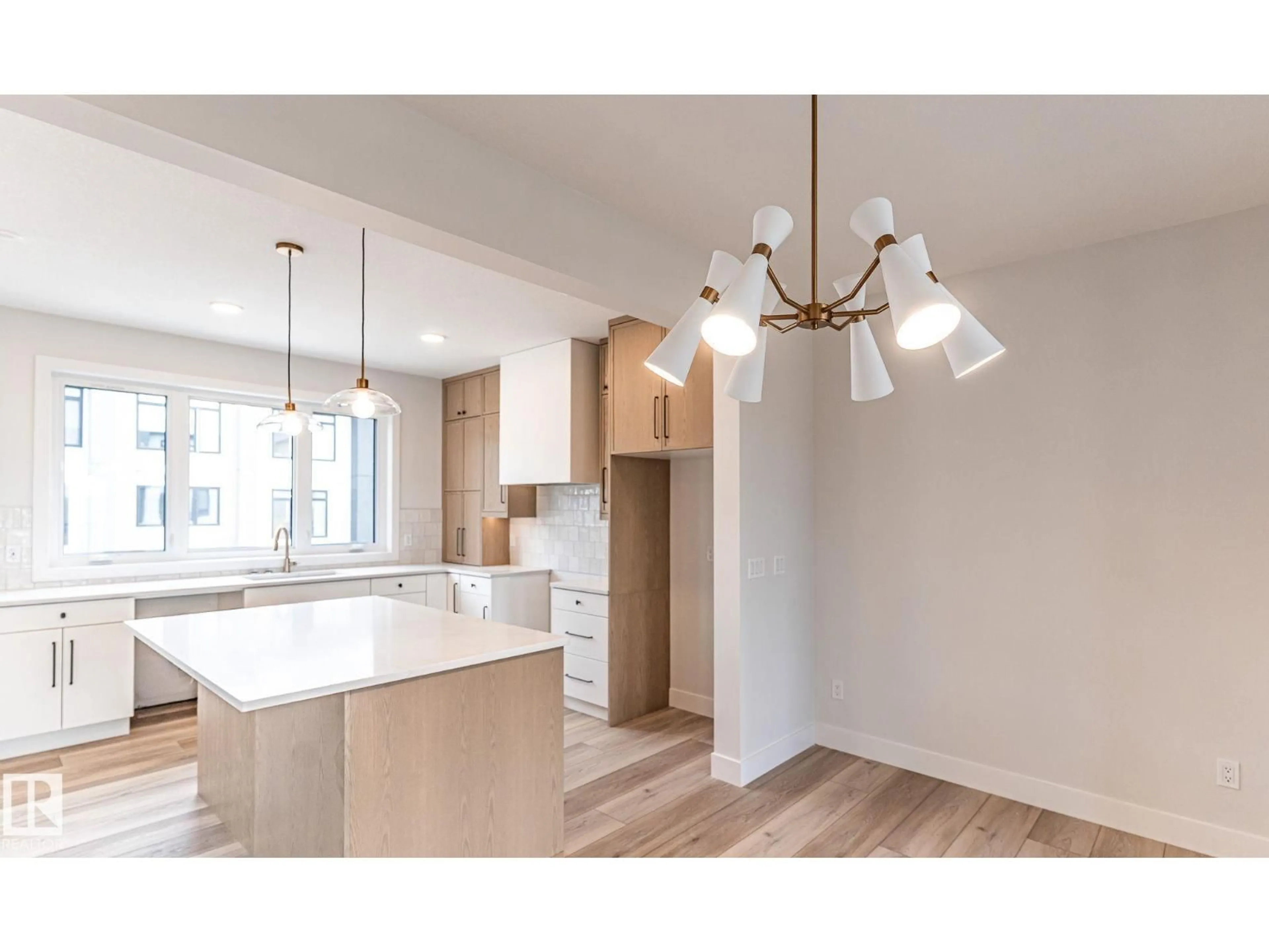 Open concept kitchen, wood/laminate floor for 7121 - 53 MAY CR, Edmonton Alberta T6R0X2