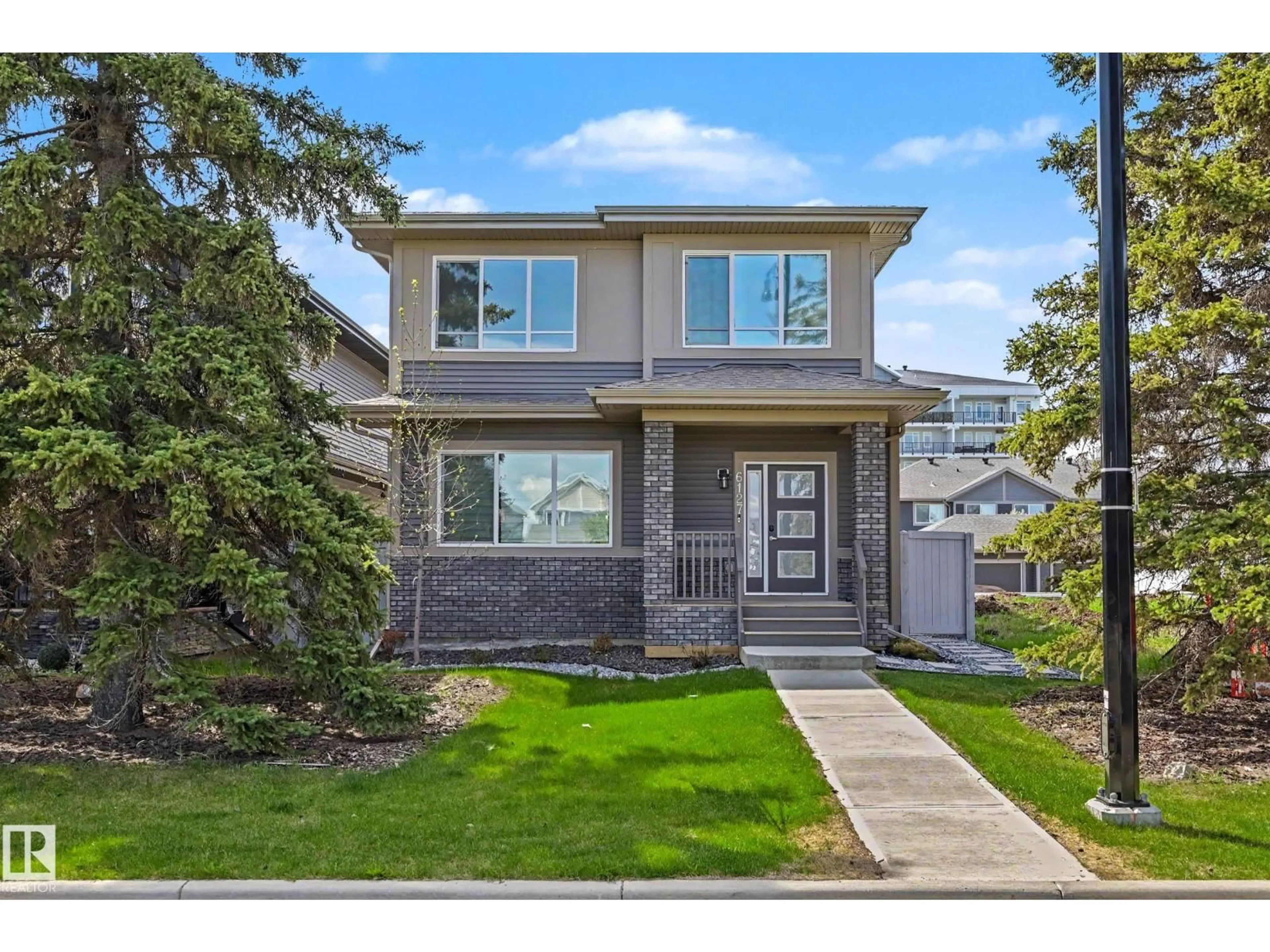 Home with vinyl exterior material, street for 6127 CARR RD, Edmonton Alberta T5E6Y4