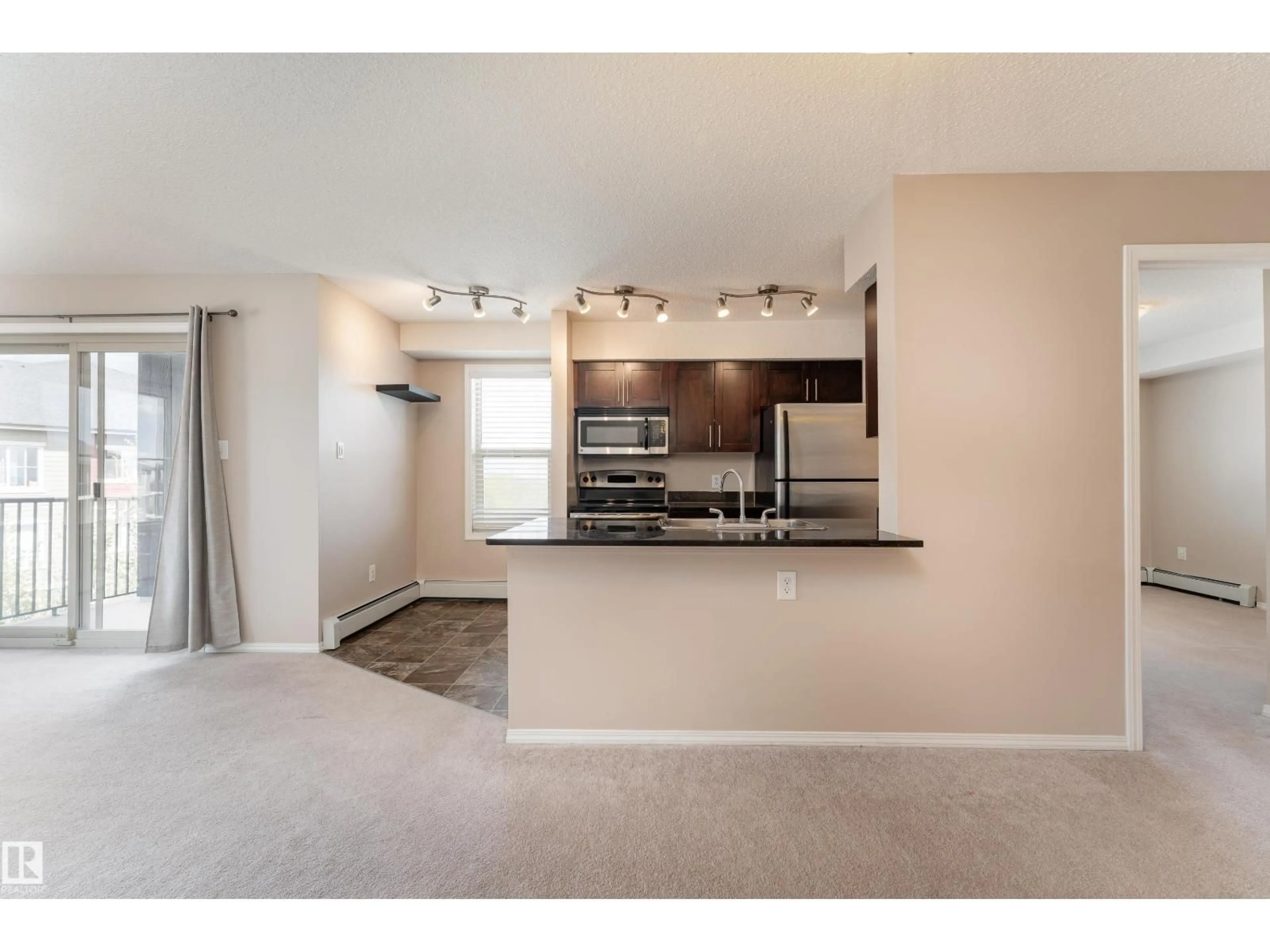 Open concept kitchen, unknown for 401 - 1080 MCCONACHIE BV, Edmonton Alberta T5Y0X2