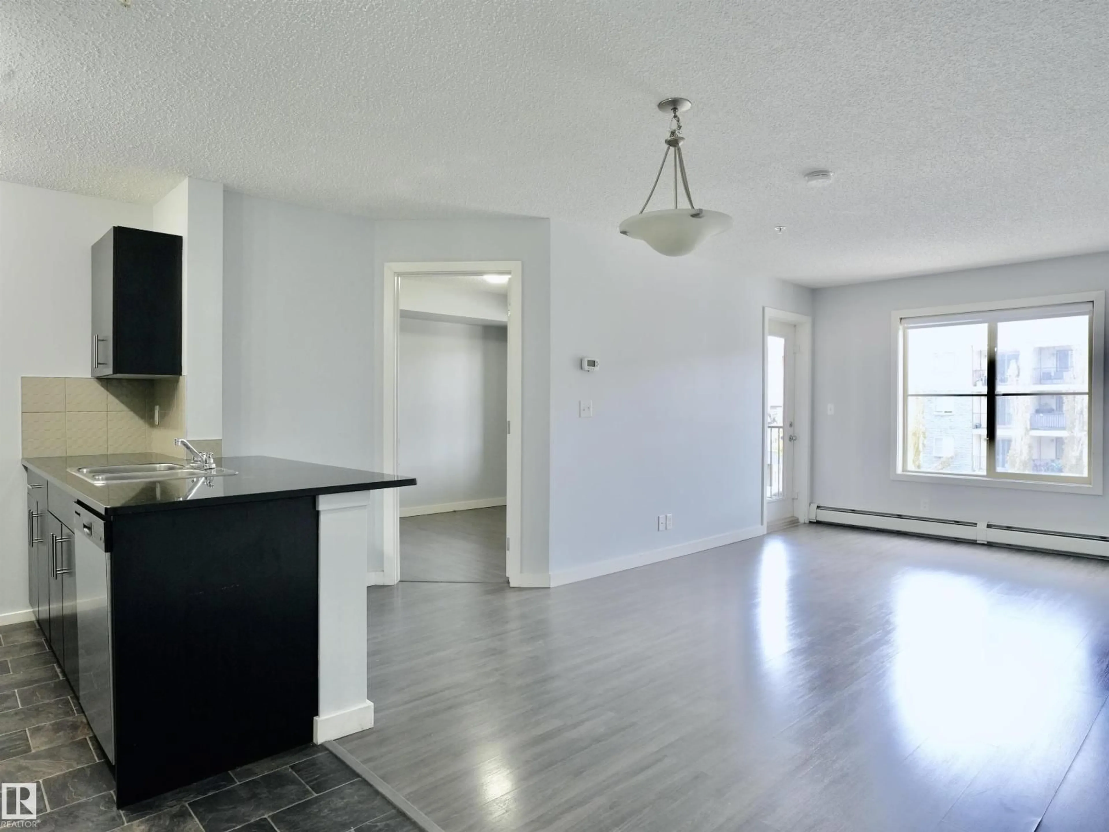 Open concept kitchen, unknown for #320 - 5816 MULLEN PL, Edmonton Alberta T6R0W3
