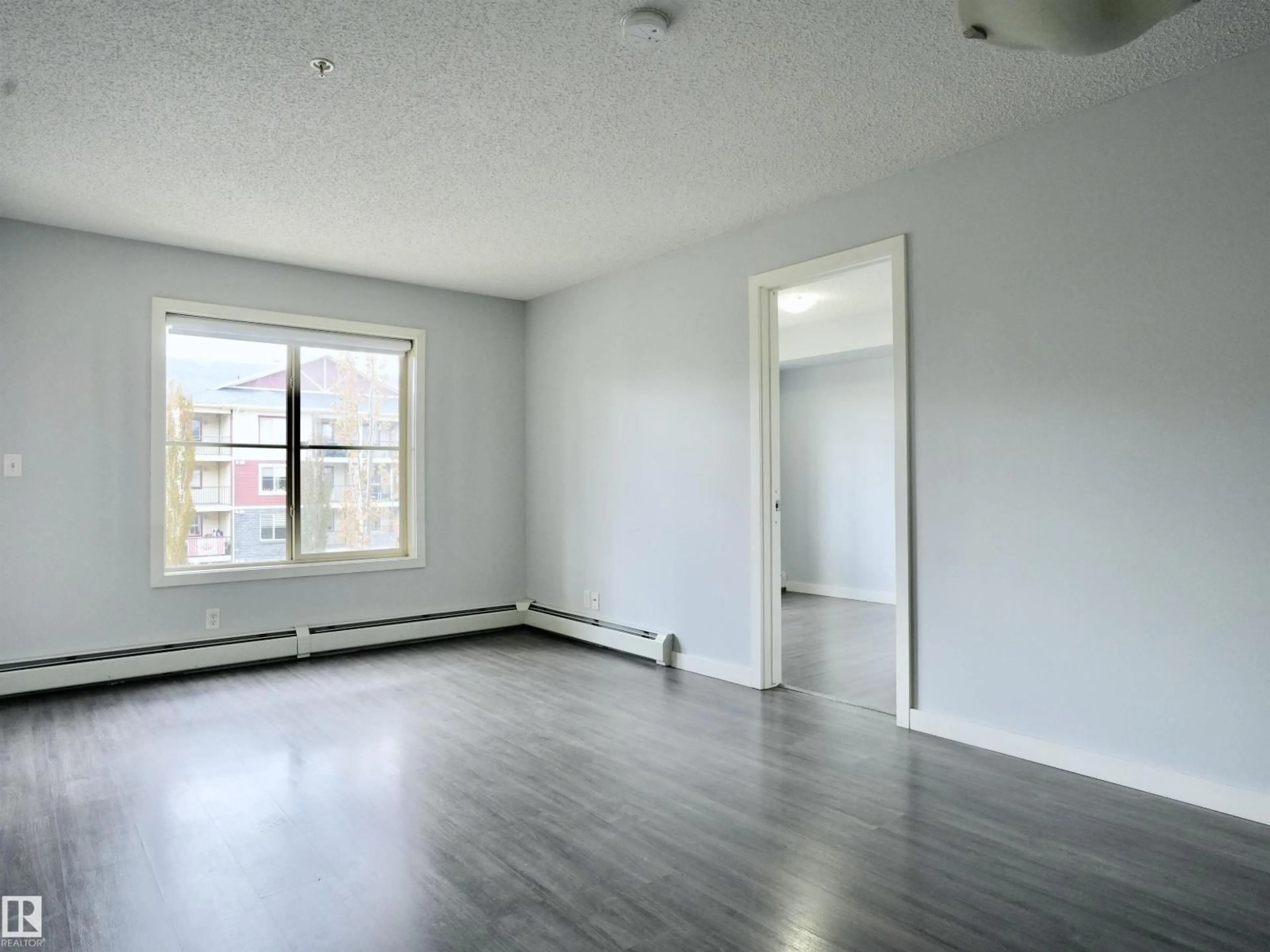 A pic of a room for #320 - 5816 MULLEN PL, Edmonton Alberta T6R0W3
