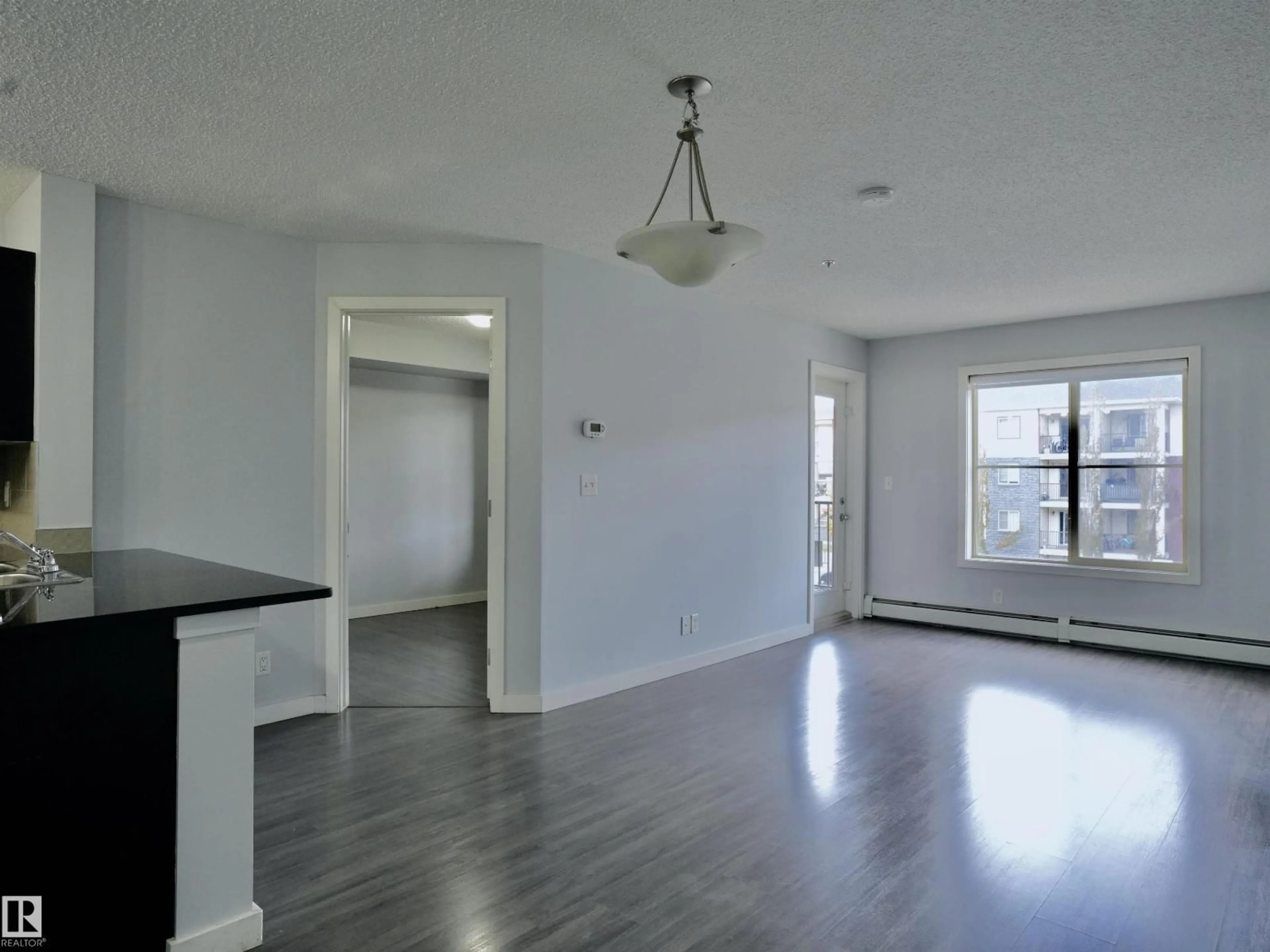 A pic of a room for #320 - 5816 MULLEN PL, Edmonton Alberta T6R0W3