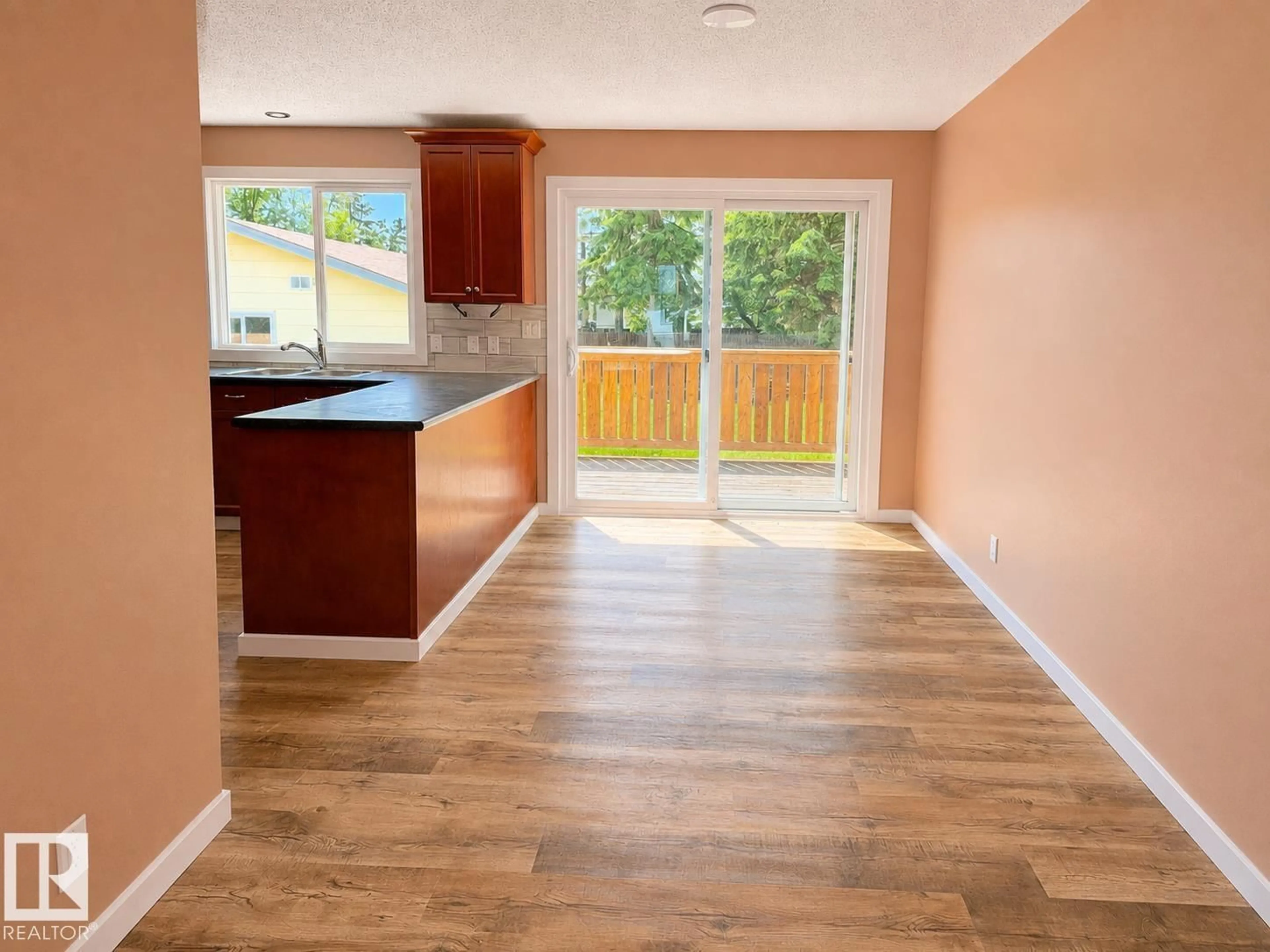 Open concept kitchen, wood/laminate floor for 4418 45 AV, Bonnyville Town Alberta T9N1X5