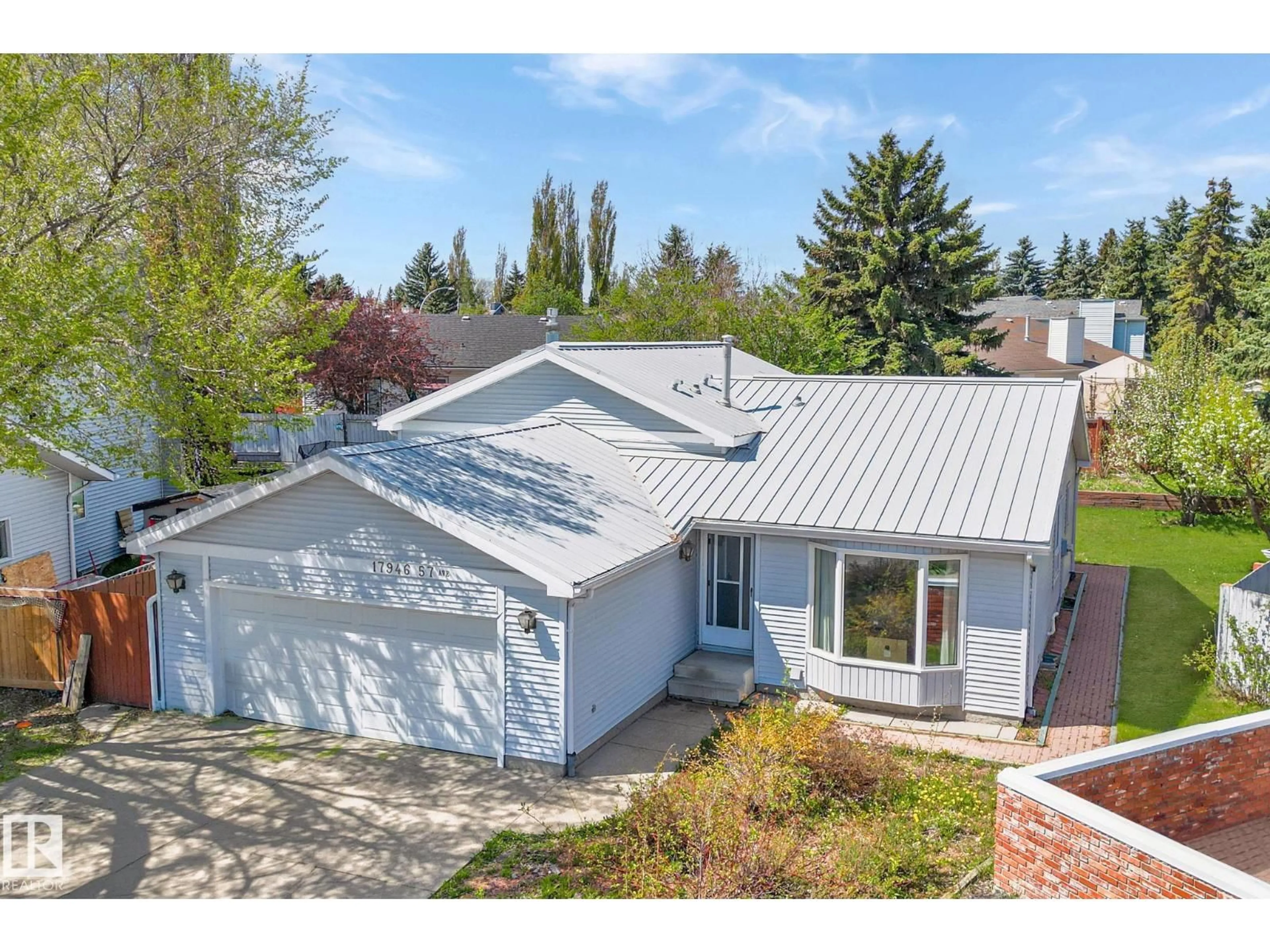 A pic from outside/outdoor area/front of a property/back of a property/a pic from drone, street for 17946 57 AV, Edmonton Alberta T6M1X3