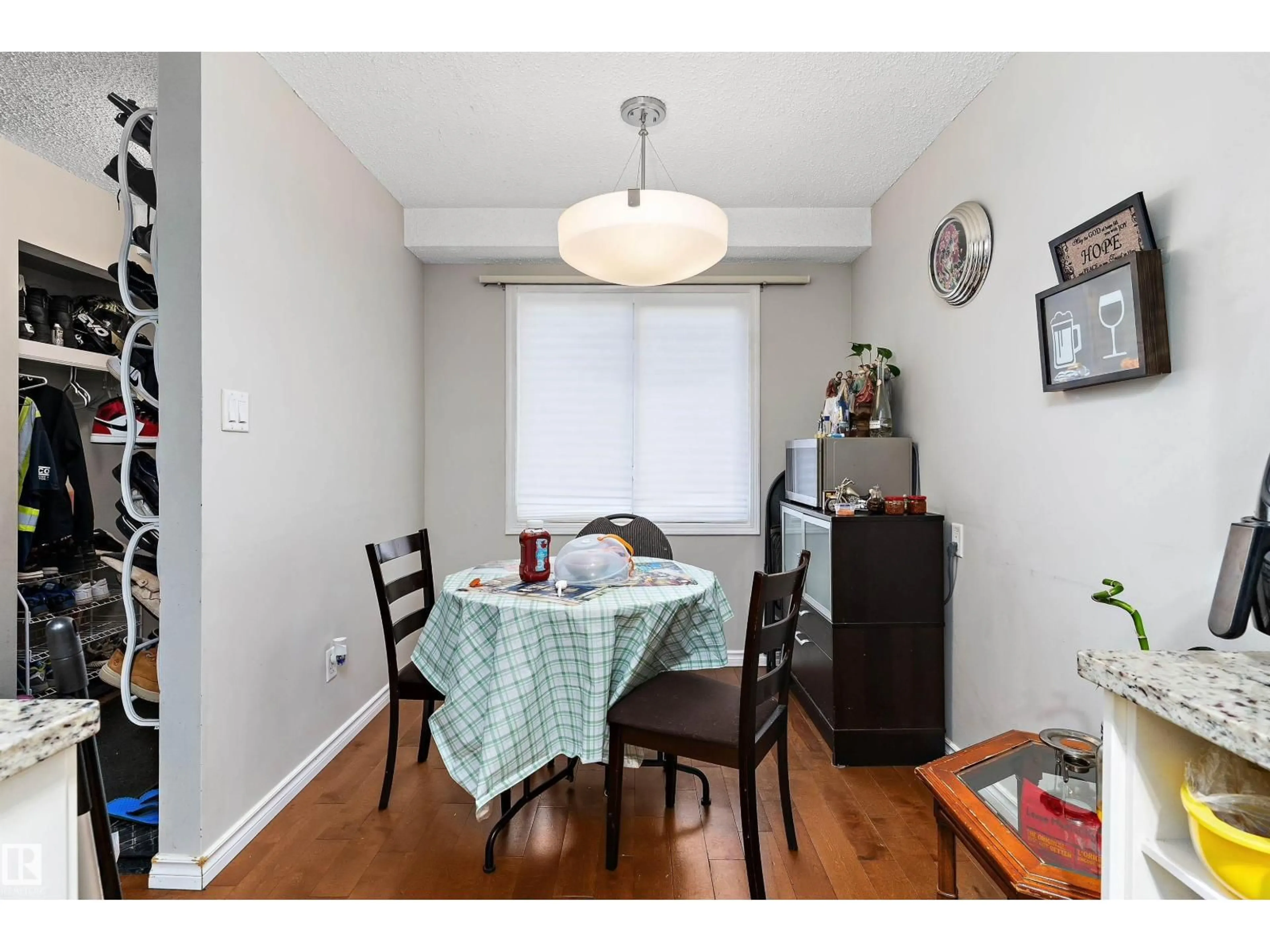 Dining room, wood/laminate floor for 6617 180 ST NW, Edmonton Alberta T5T2A3