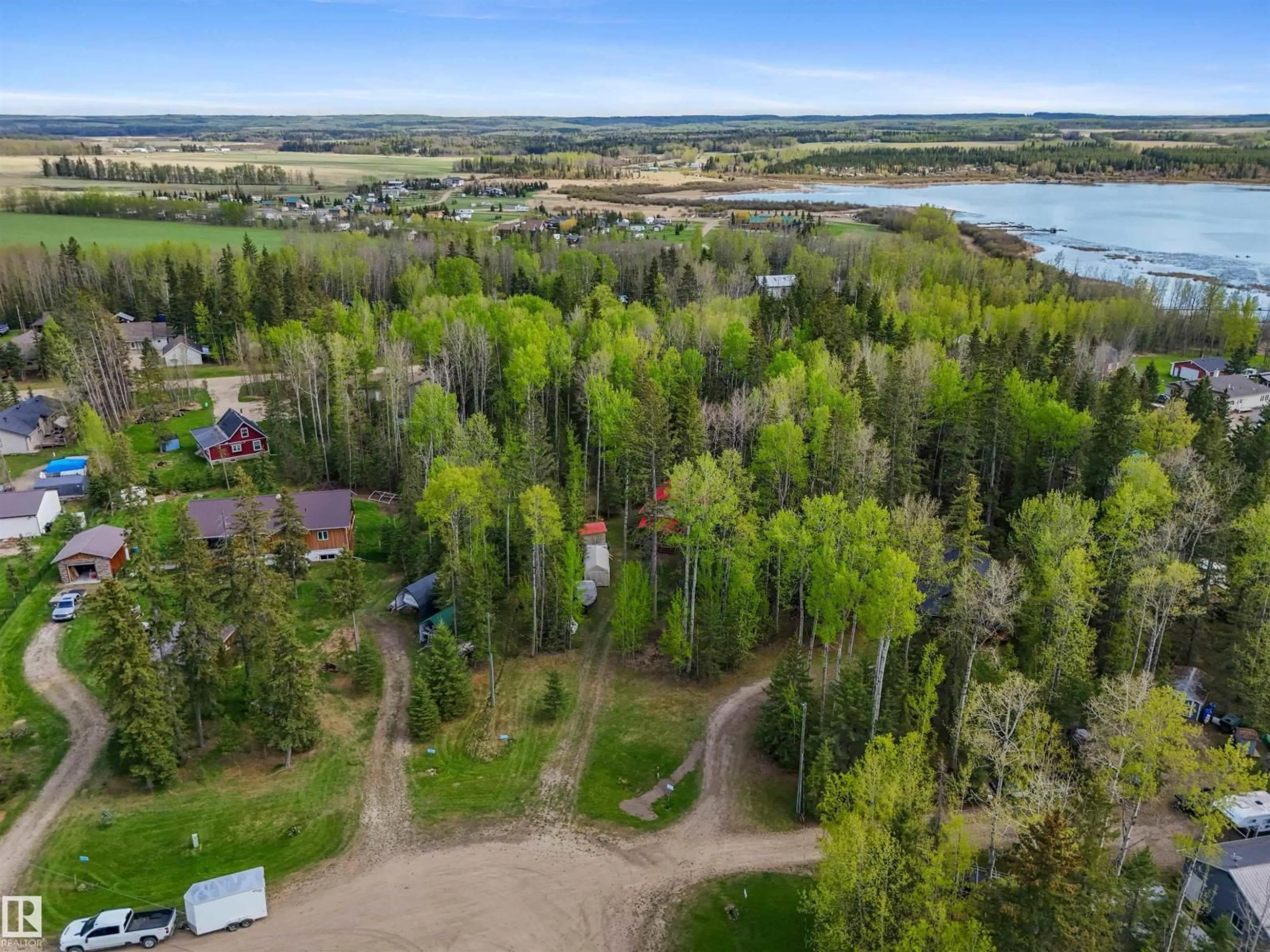 A pic from outside/outdoor area/front of a property/back of a property/a pic from drone, water/lake/river/ocean view for 313 - 55061 TWP ROAD 462, Rural Wetaskiwin County Alberta T0C0T0