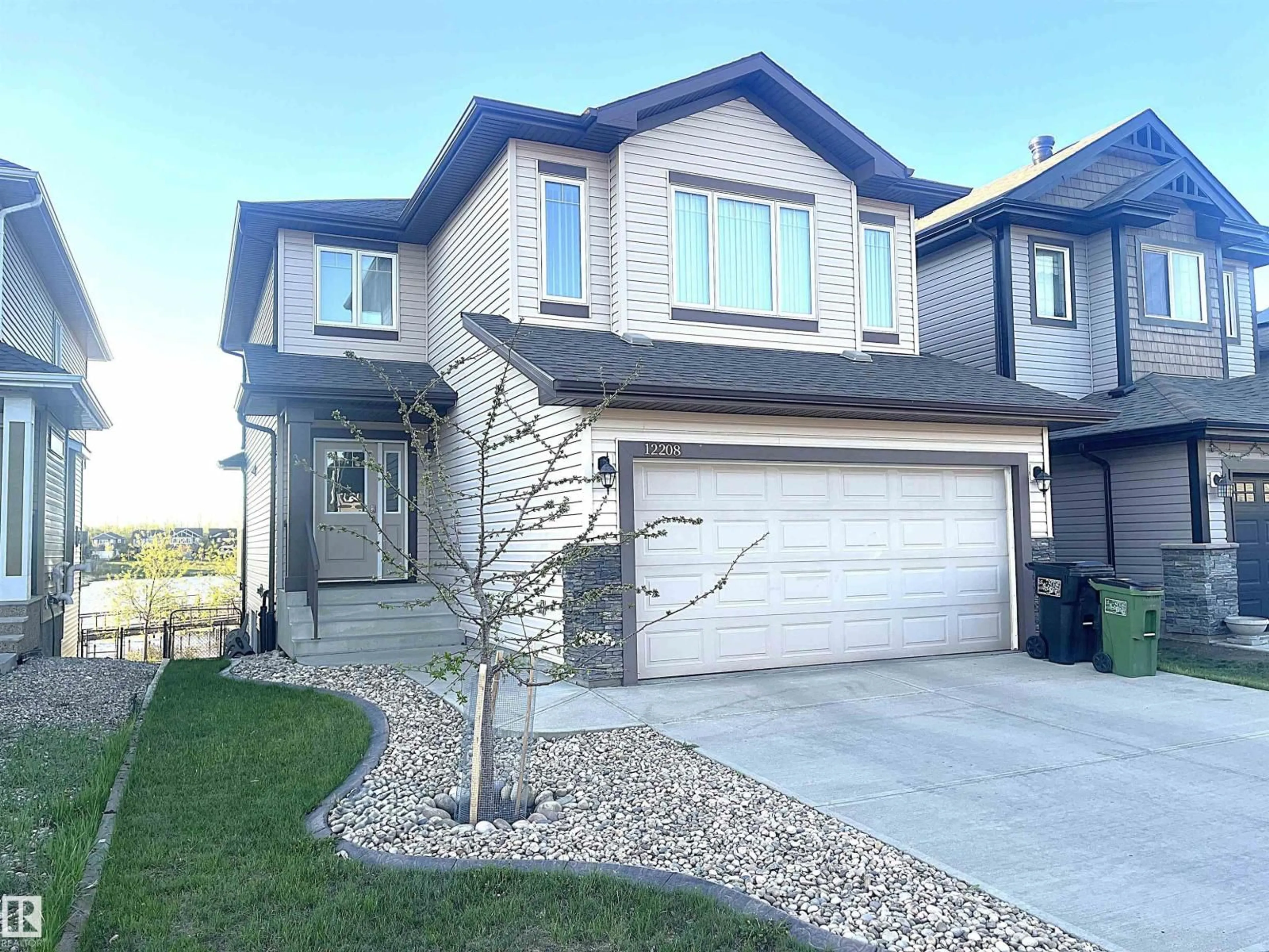 Home with vinyl exterior material, street for 12208 168 AV, Edmonton Alberta T5X0J1