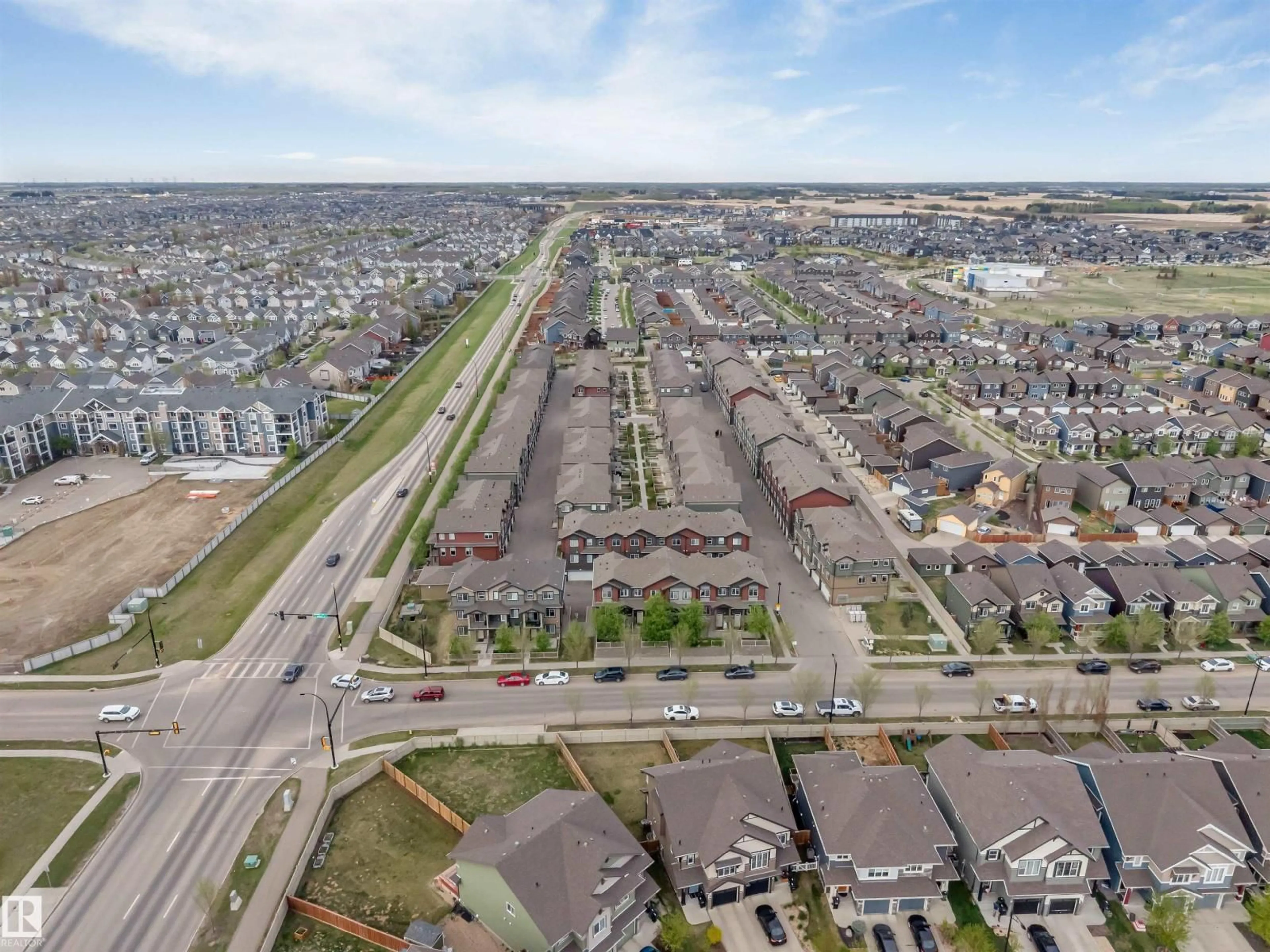 A pic from outside/outdoor area/front of a property/back of a property/a pic from drone, street for #30 - 3305 ORCHARDS LI, Edmonton Alberta T6X2H1
