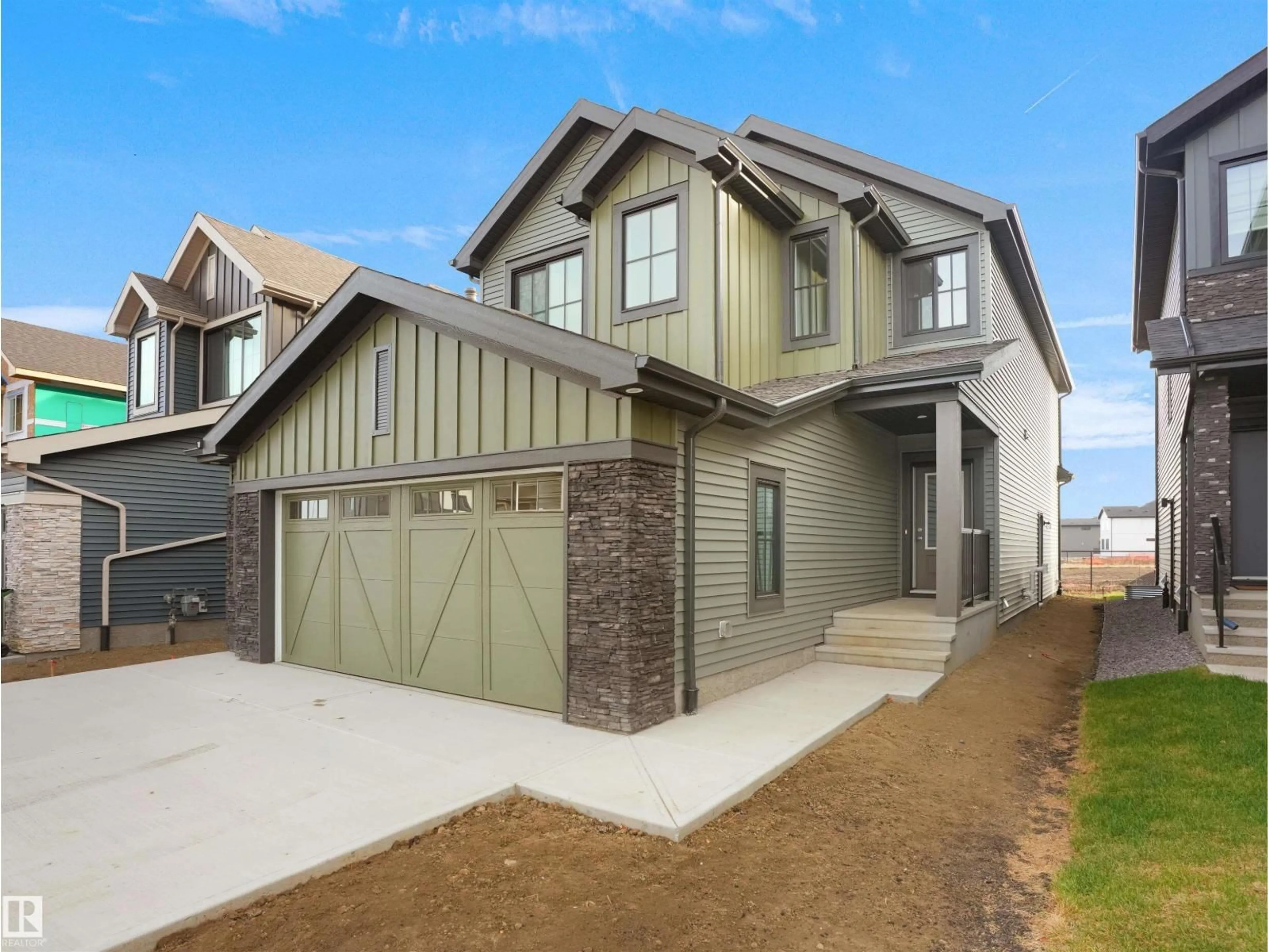 Home with vinyl exterior material, street for 6343 175 AV, Edmonton Alberta T5Y4B7