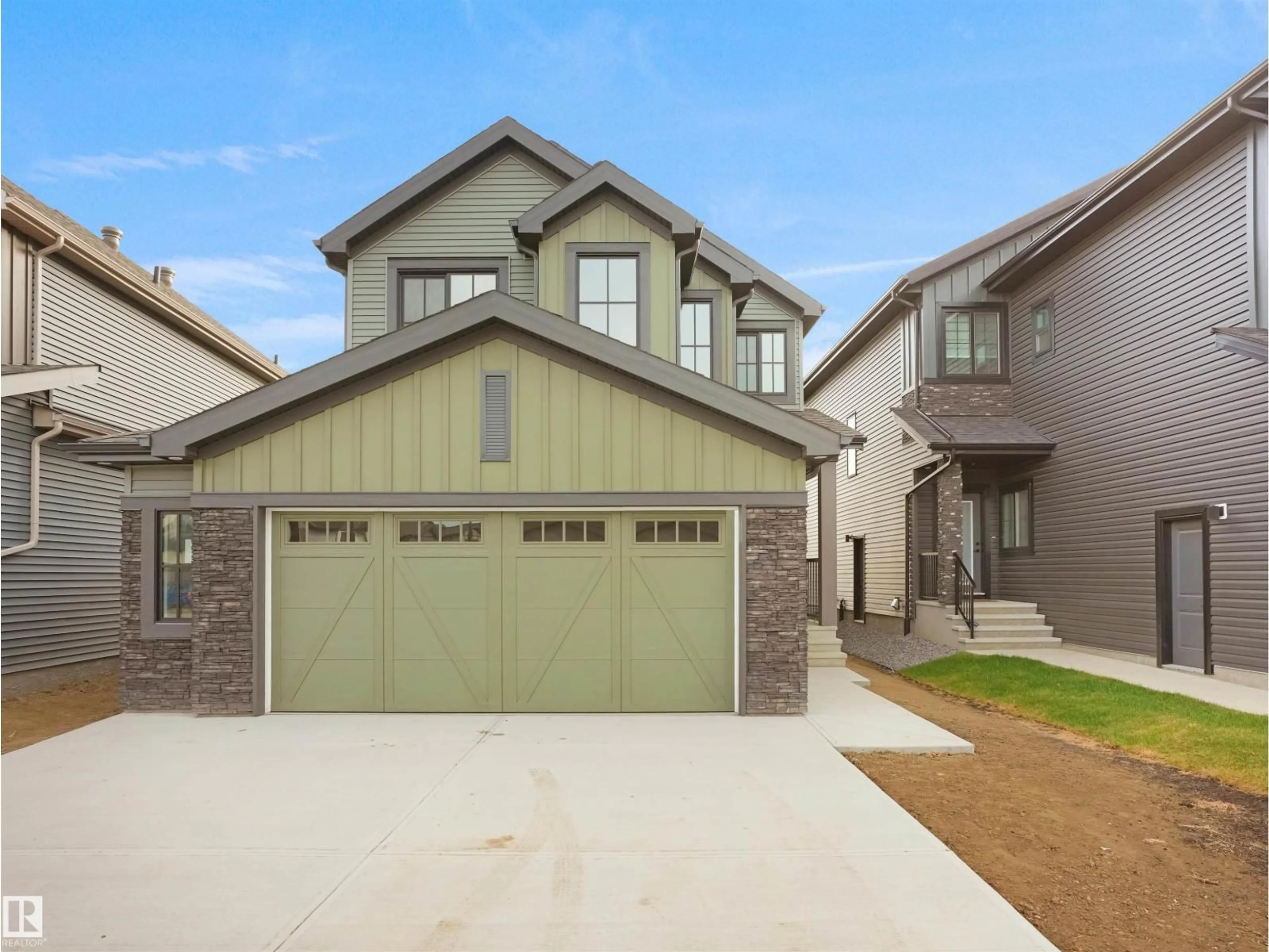 Home with vinyl exterior material, street for 6343 175 AV, Edmonton Alberta T5Y4B7