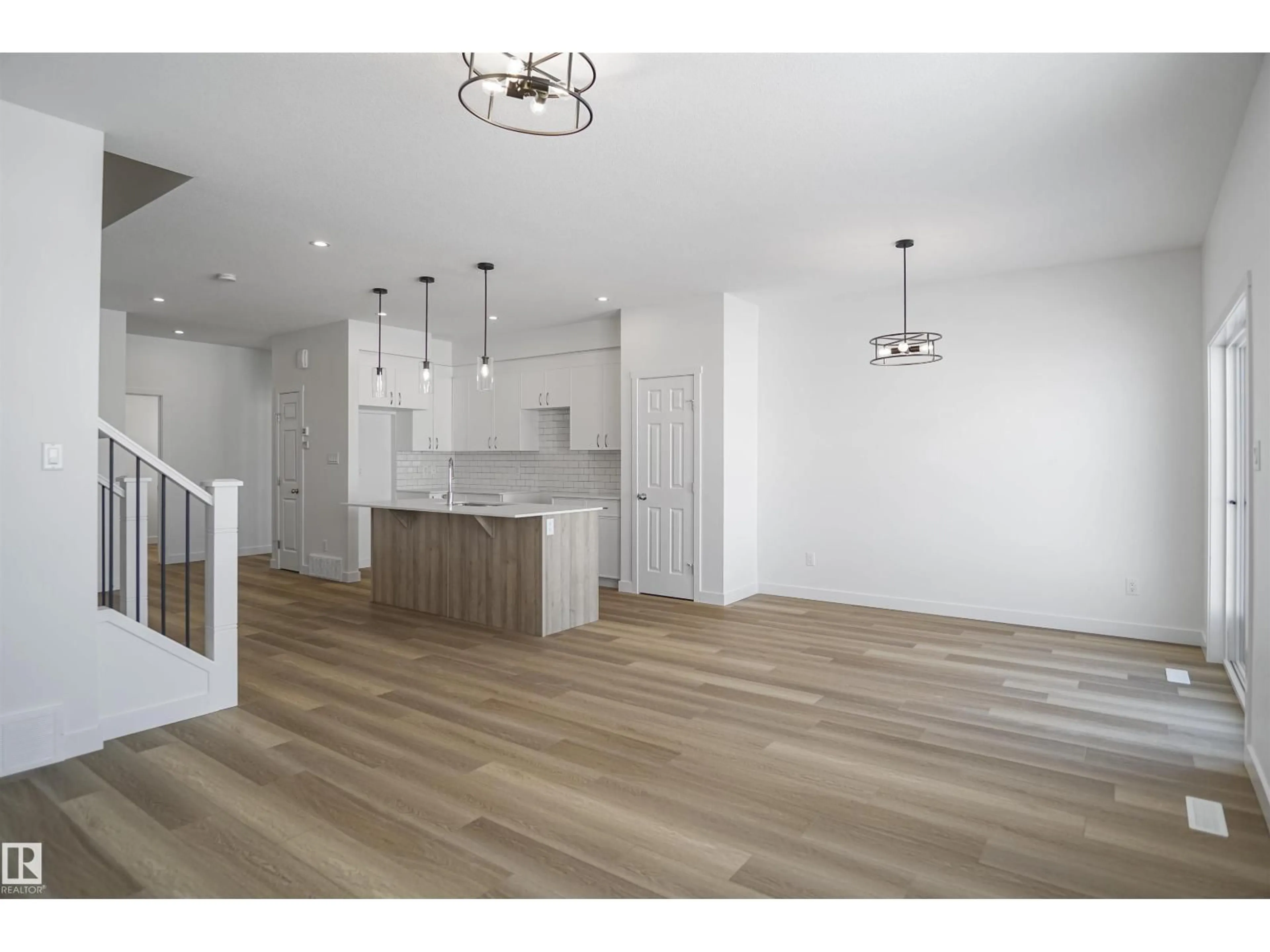 Open concept kitchen, wood/laminate floor for 6327 175 AV, Edmonton Alberta T5Z0V6