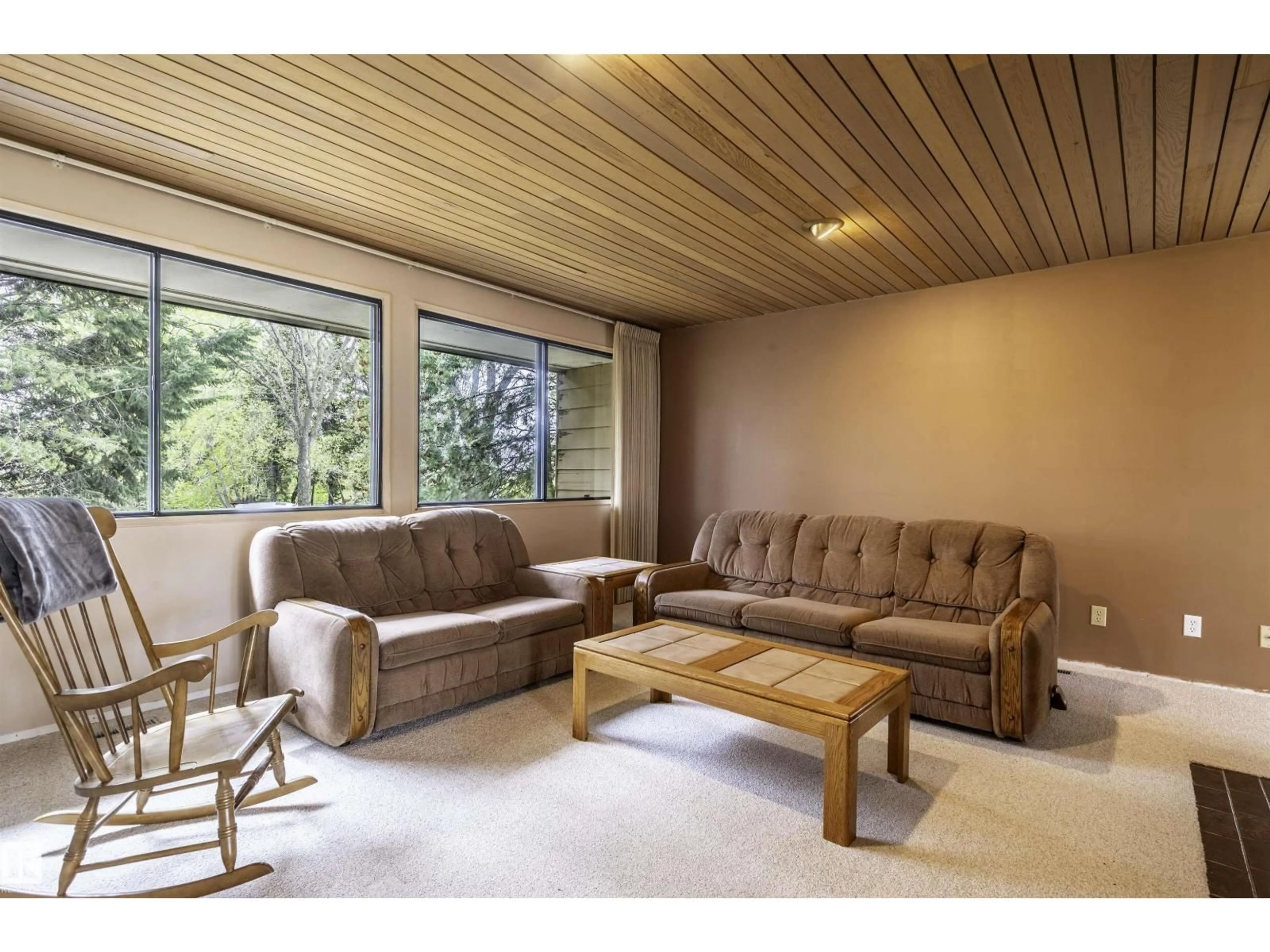 Living room with furniture, wood/laminate floor for 55305 - 18 RANGE RD 242, Rural Sturgeon County Alberta T8T1Y1