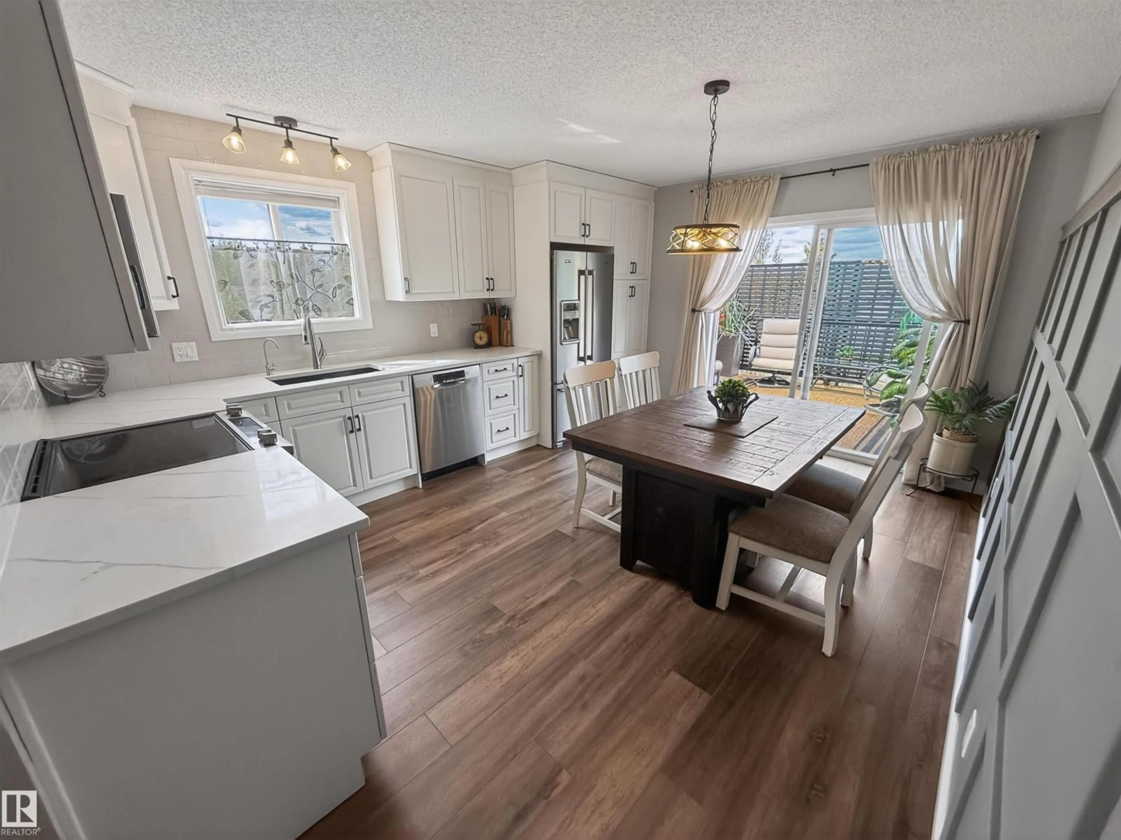 Open concept kitchen, wood/laminate floor for 86 LA COSTA FAIRWAY CL, Stony Plain Alberta T7Z2A5