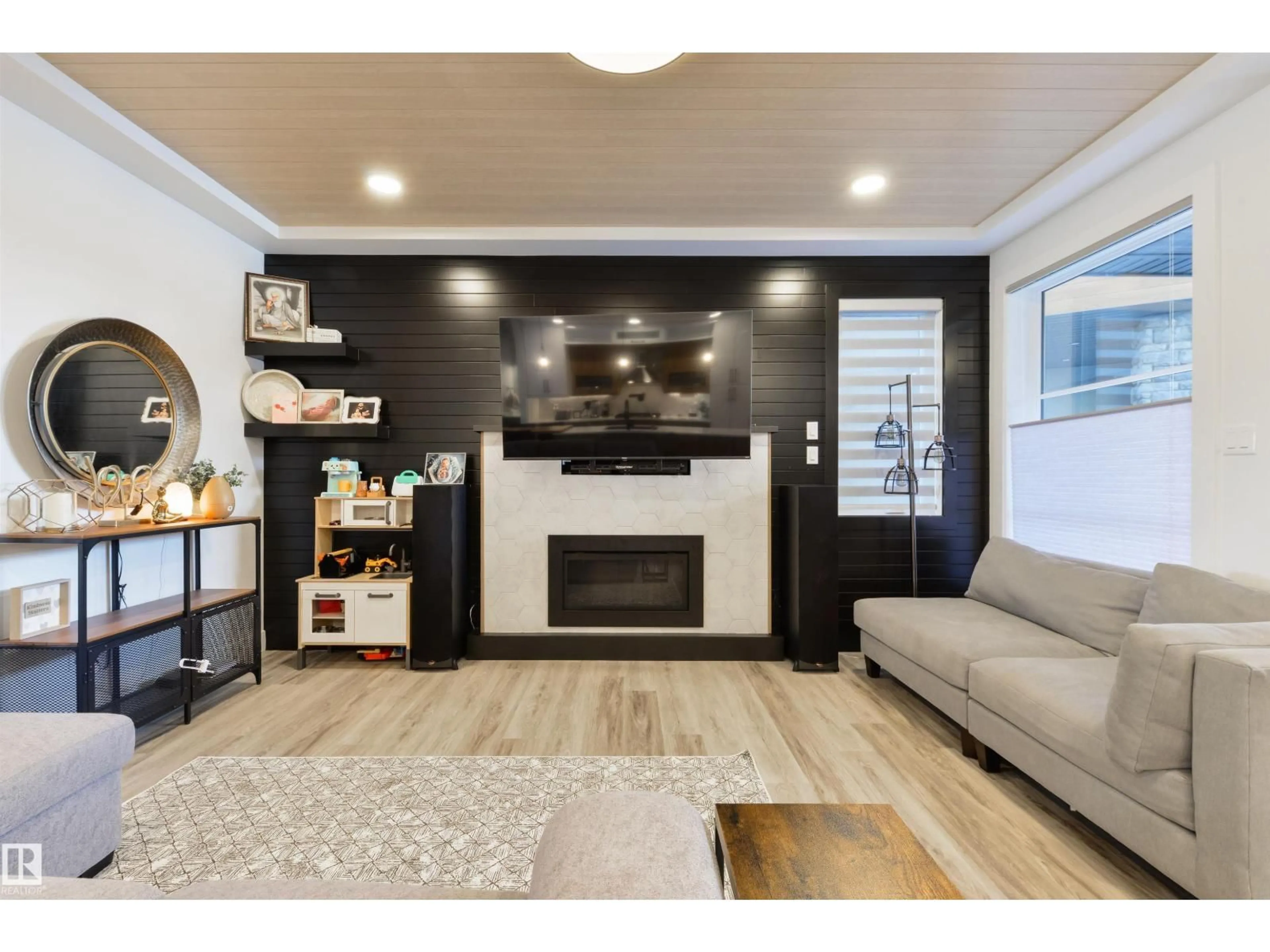 Living room with furniture, wood/laminate floor for 219 37 ST, Edmonton Alberta T6X2W4