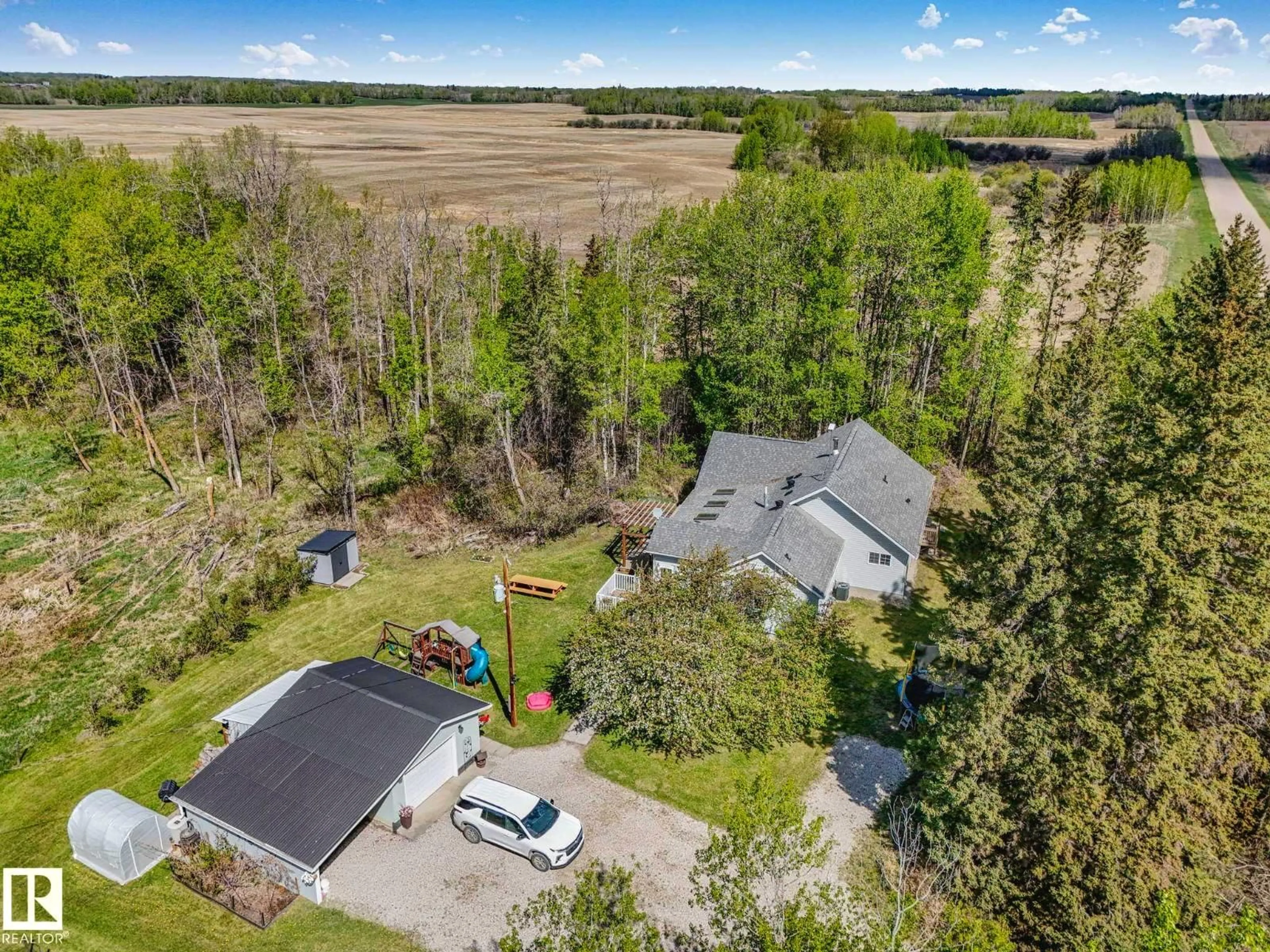 A pic from outside/outdoor area/front of a property/back of a property/a pic from drone, unknown for 51026 RGE ROAD 20, Rural Parkland County Alberta T7Y2G2