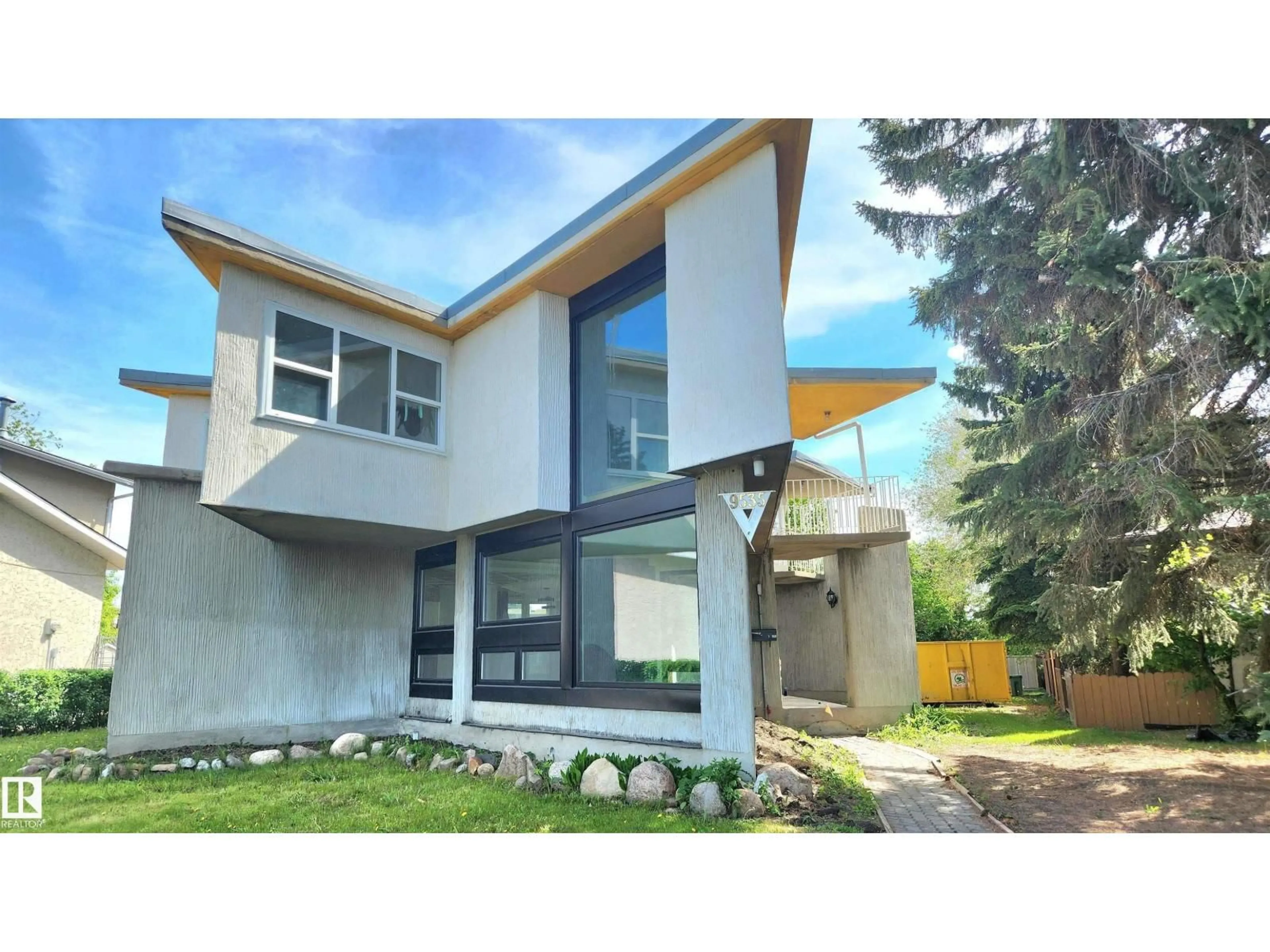Home with vinyl exterior material, street for 9535 147 AV, Edmonton Alberta T5E2K5