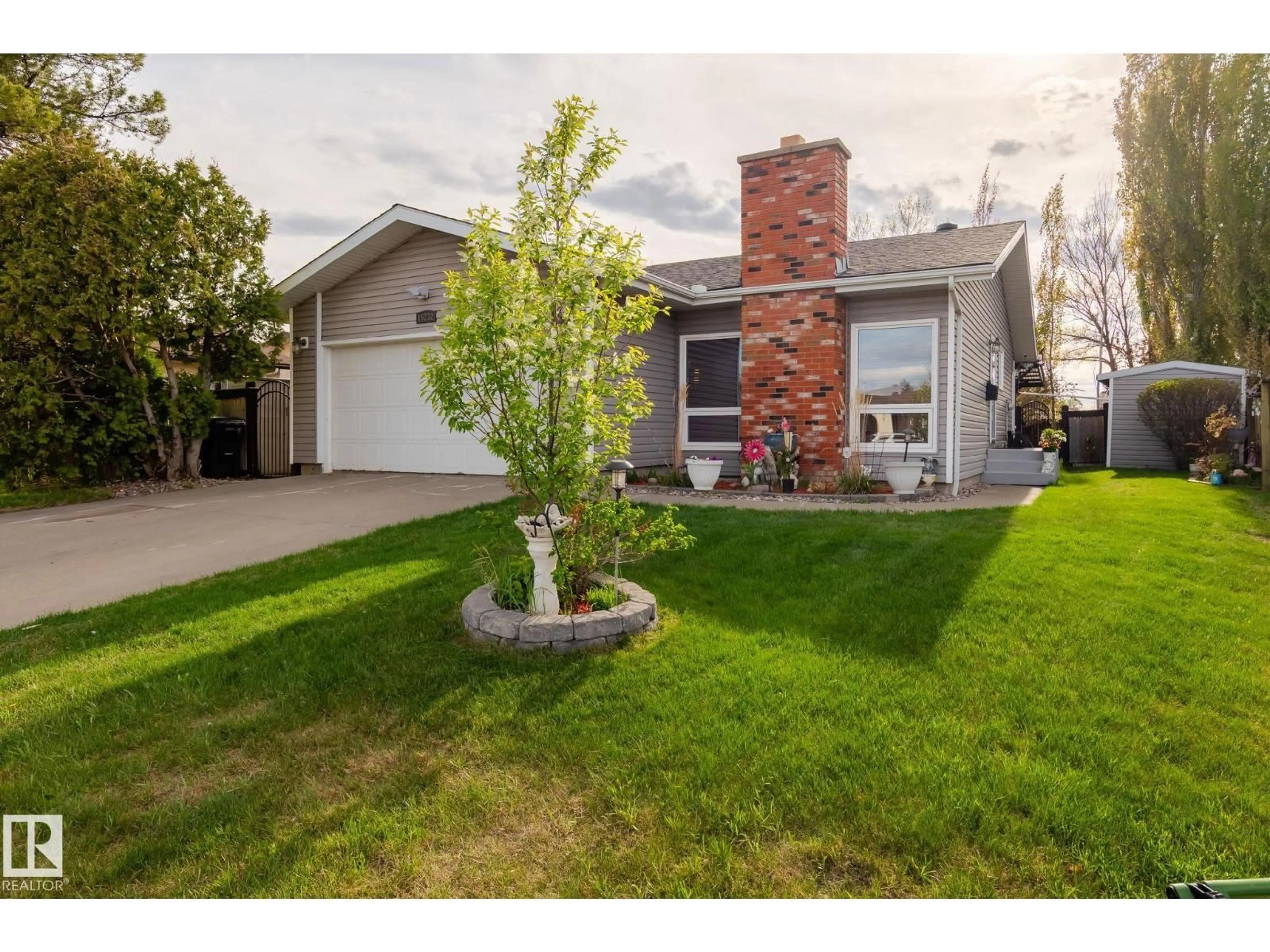Home with vinyl exterior material, street for 15232 120 NW, Edmonton Alberta T5X1N9