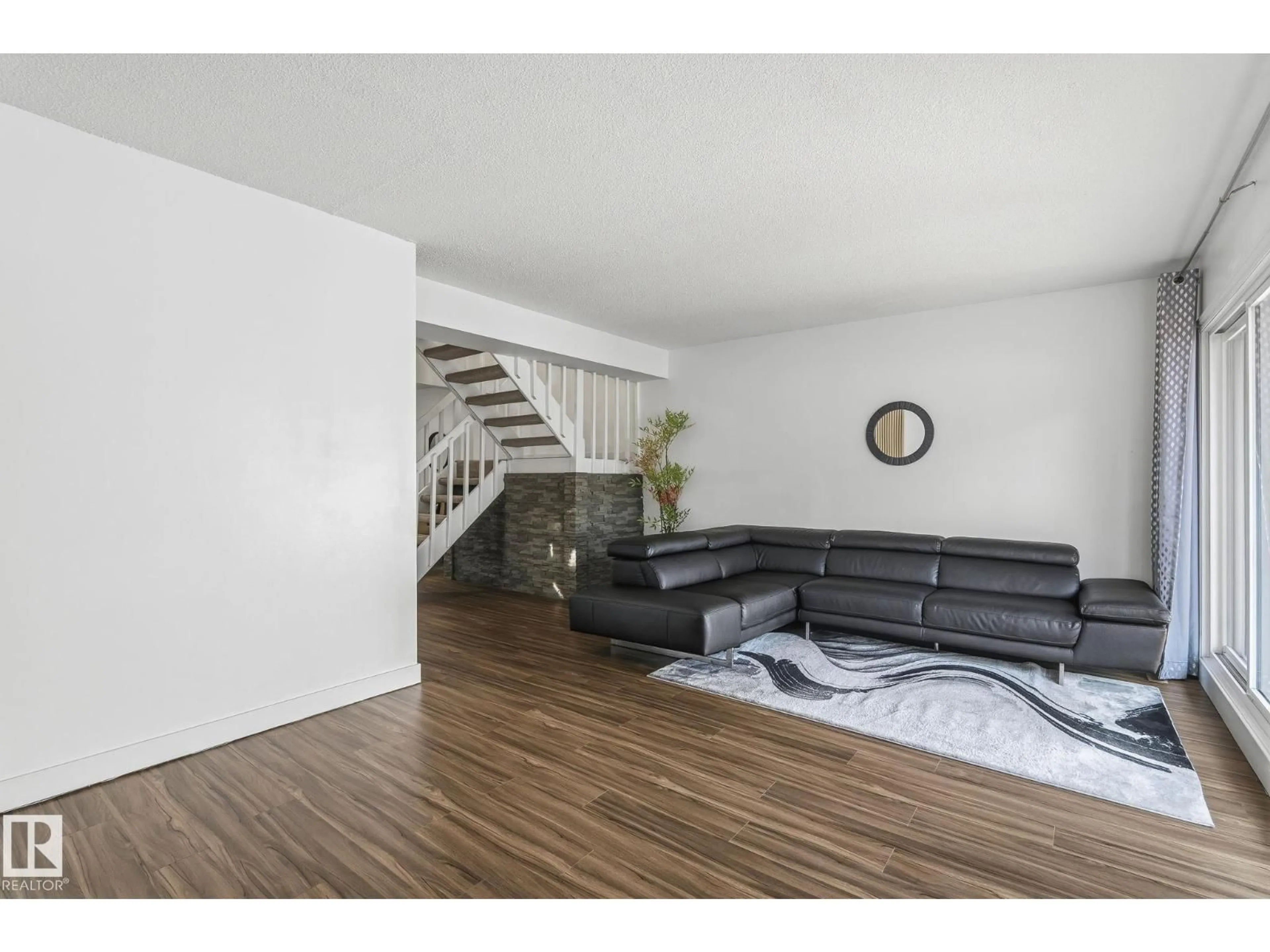 Living room with furniture, wood/laminate floor for 28C MEADOWLARK VILLAGE, Edmonton Alberta T5R5X4