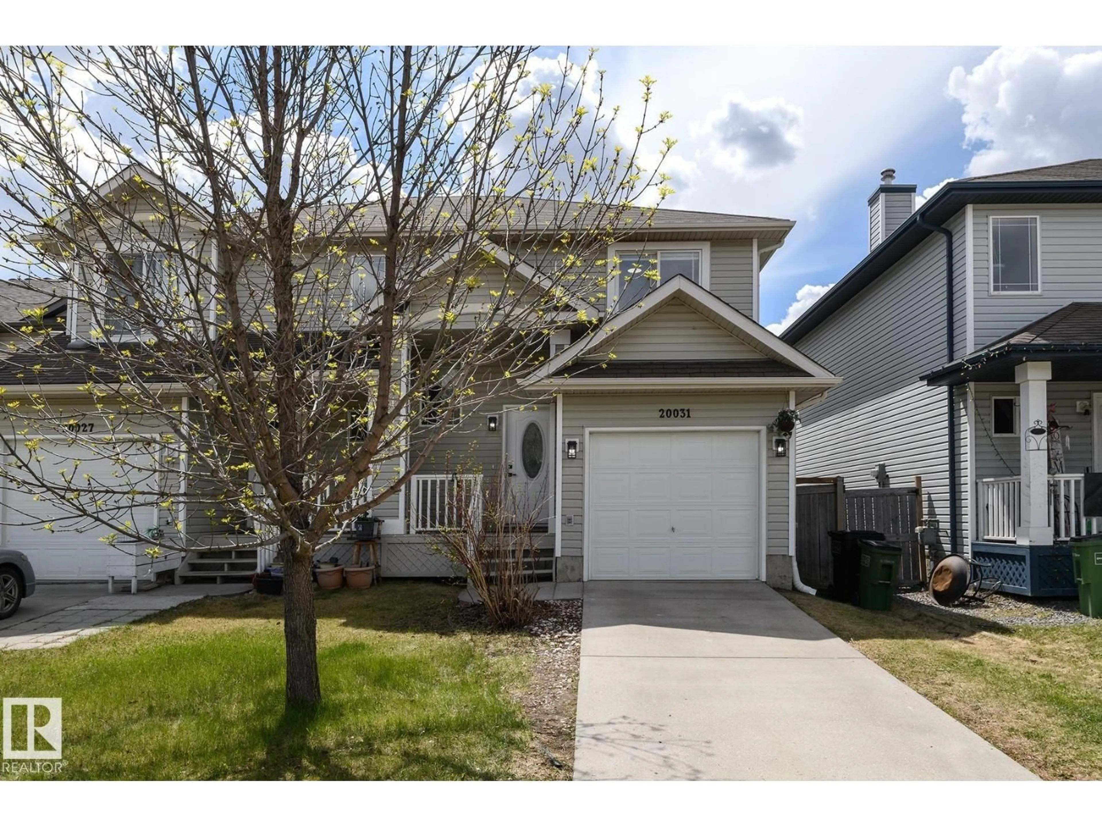Home with vinyl exterior material, street for 20031 53A AV, Edmonton Alberta T6M2W2