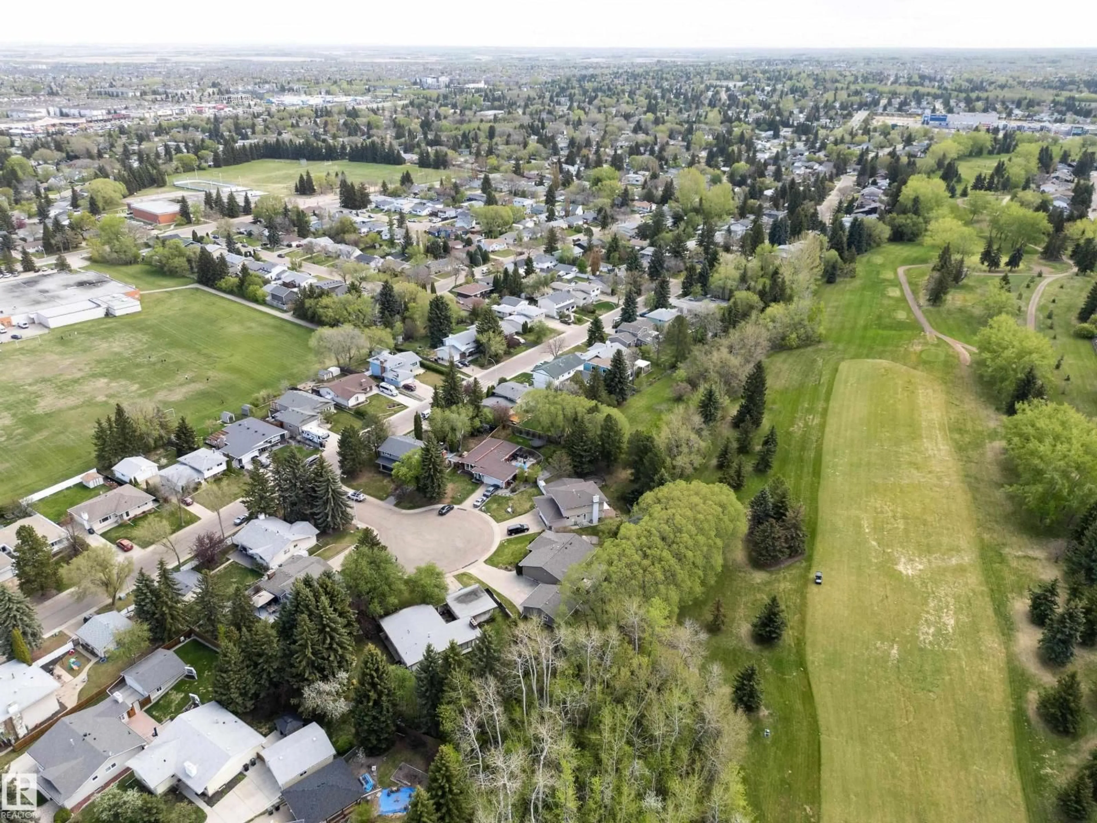 A pic from outside/outdoor area/front of a property/back of a property/a pic from drone, mountain view for 205 MANOR CO, Sherwood Park Alberta T8A0S8