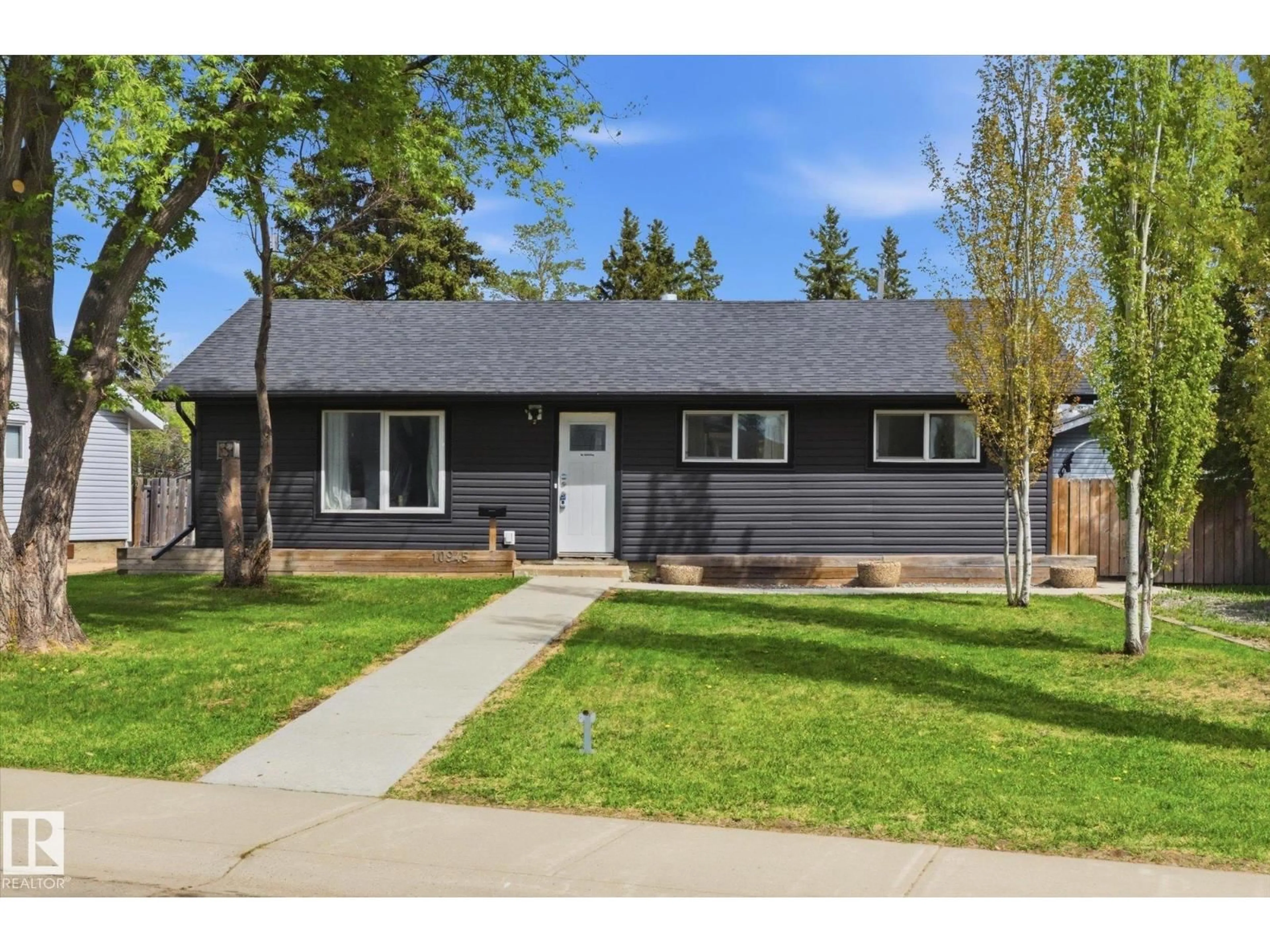 Home with vinyl exterior material, street for NW - 10945 164 ST, Edmonton Alberta T5P3S2