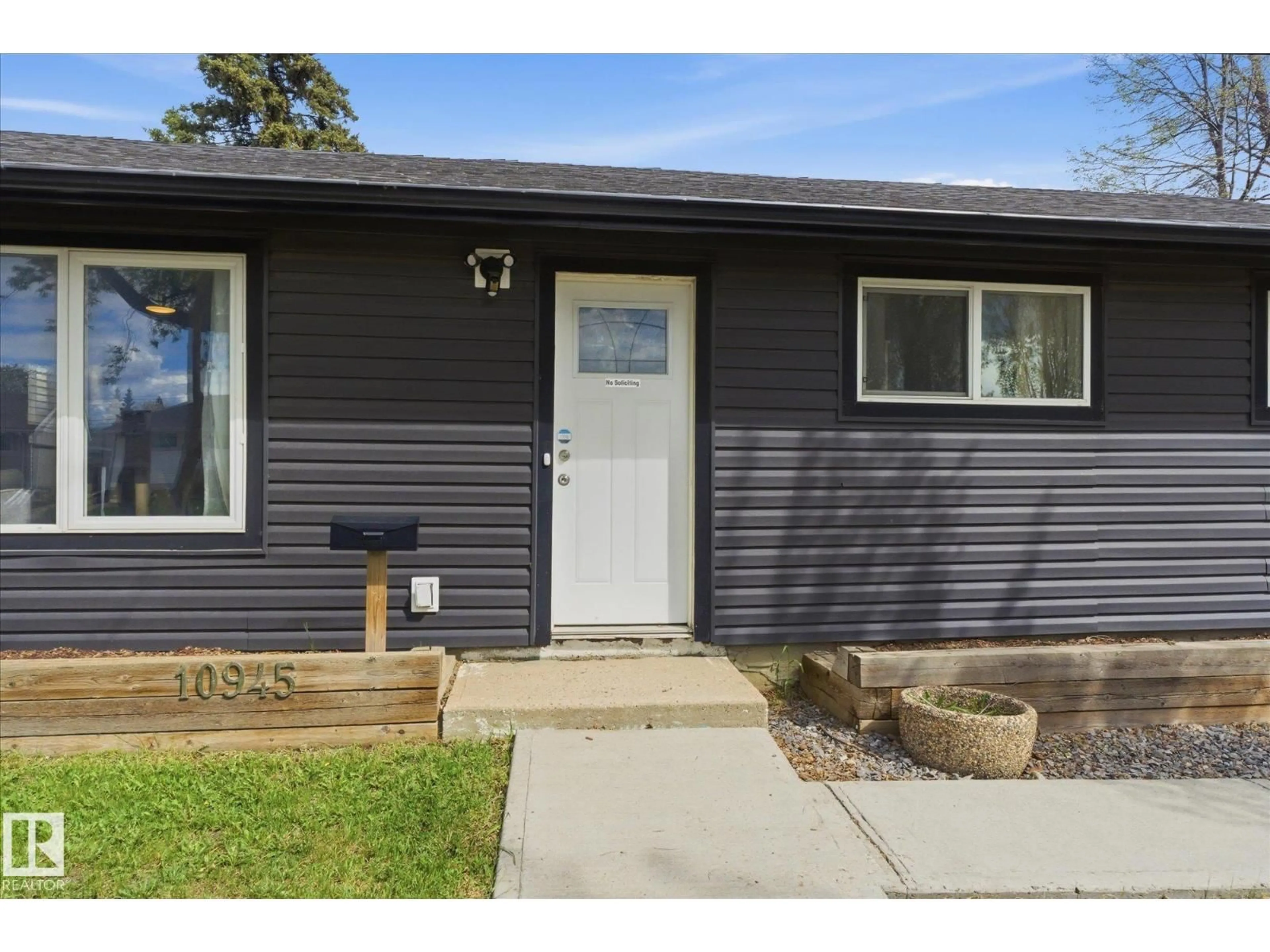 Home with vinyl exterior material, street for NW - 10945 164 ST, Edmonton Alberta T5P3S2