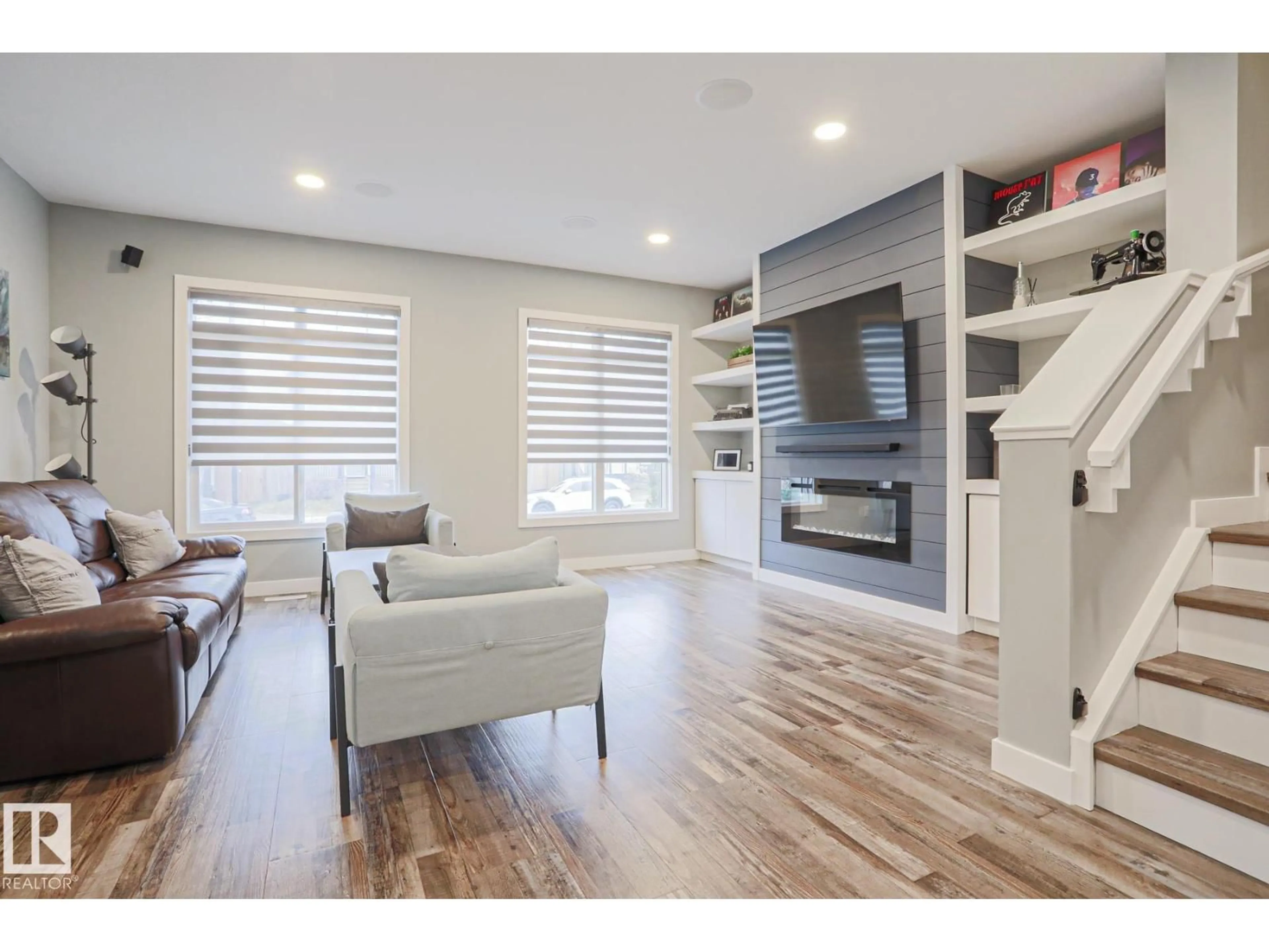 Living room with furniture, wood/laminate floor for 661 LEWIS GREENS DR, Edmonton Alberta T5T7G3