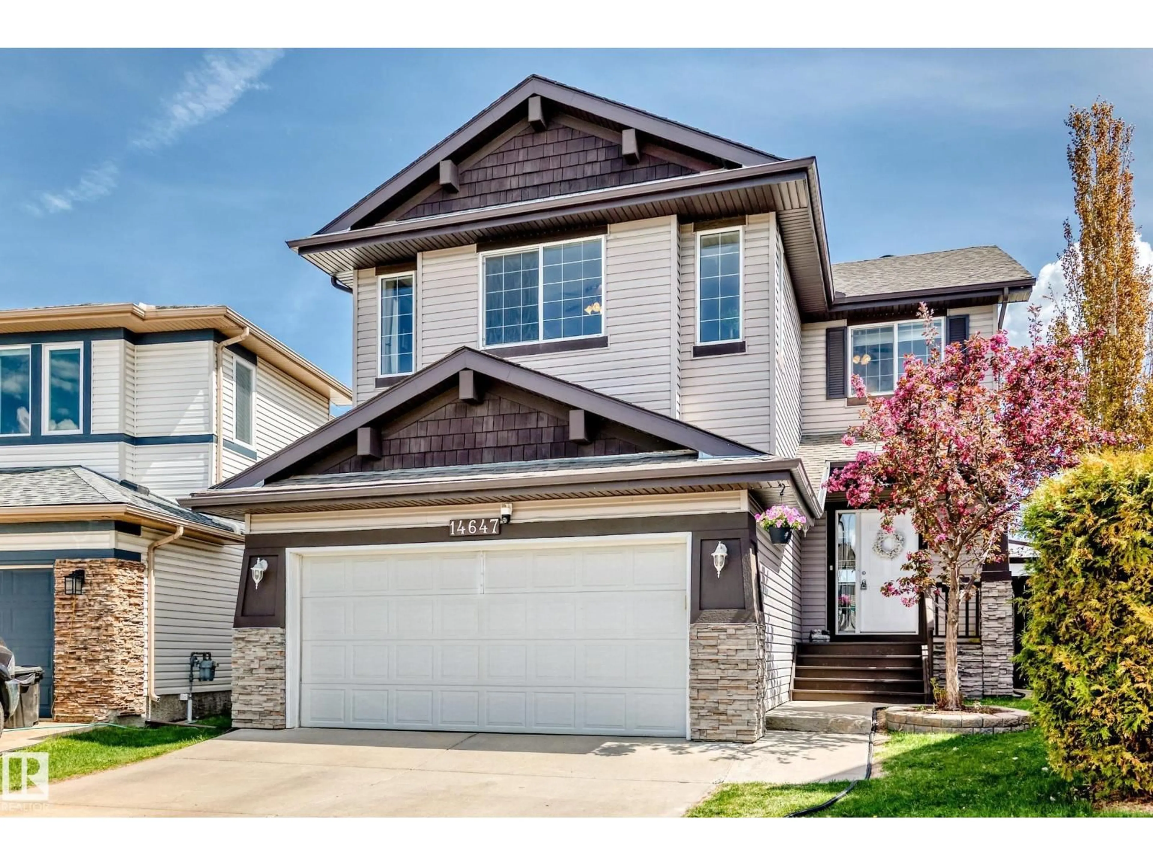 Home with vinyl exterior material, street for 14647 137 ST, Edmonton Alberta T6V1V2
