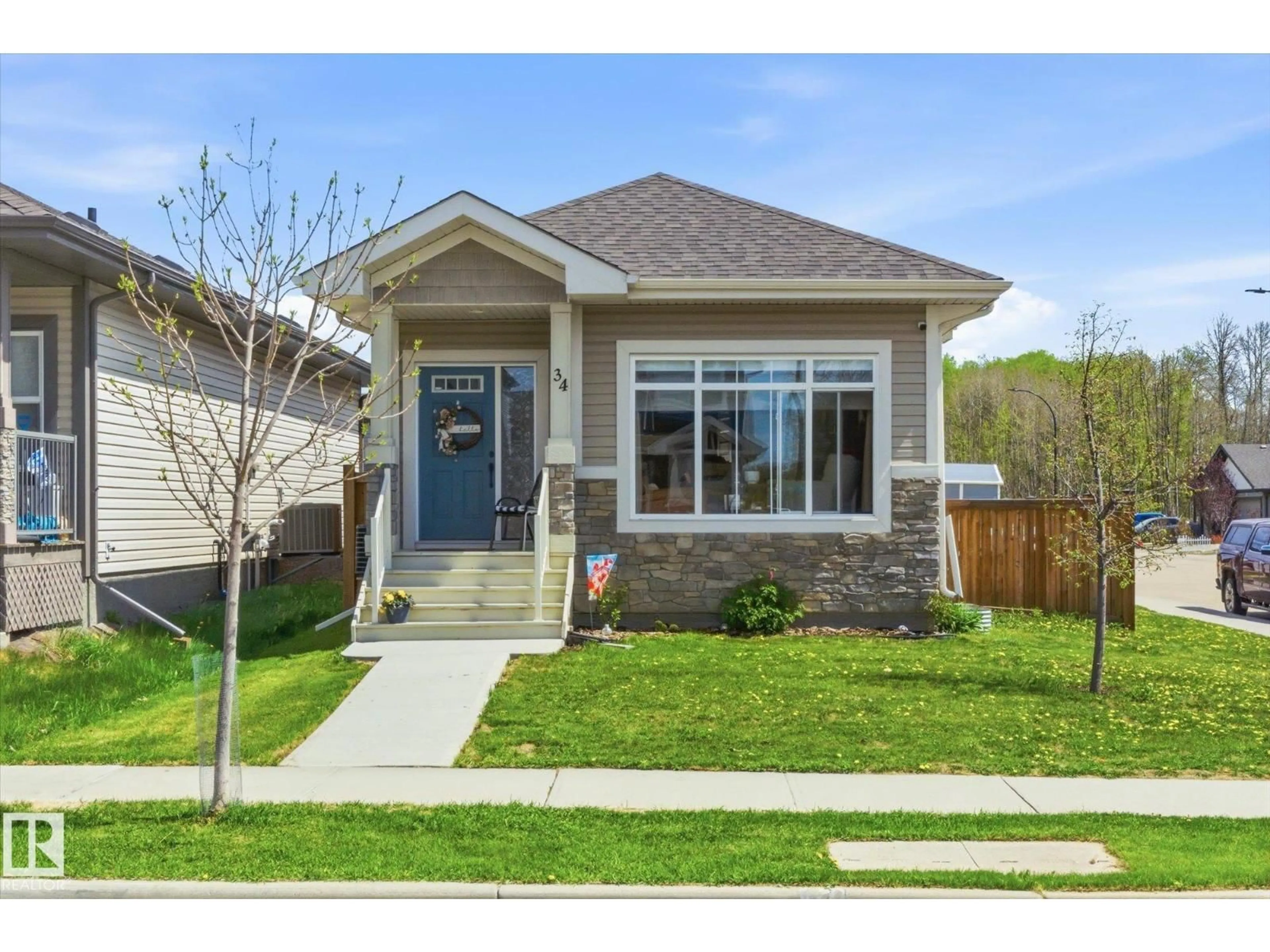 Home with brick exterior material, street for 34 BRICKYARD DR, Stony Plain Alberta T7Z0L2
