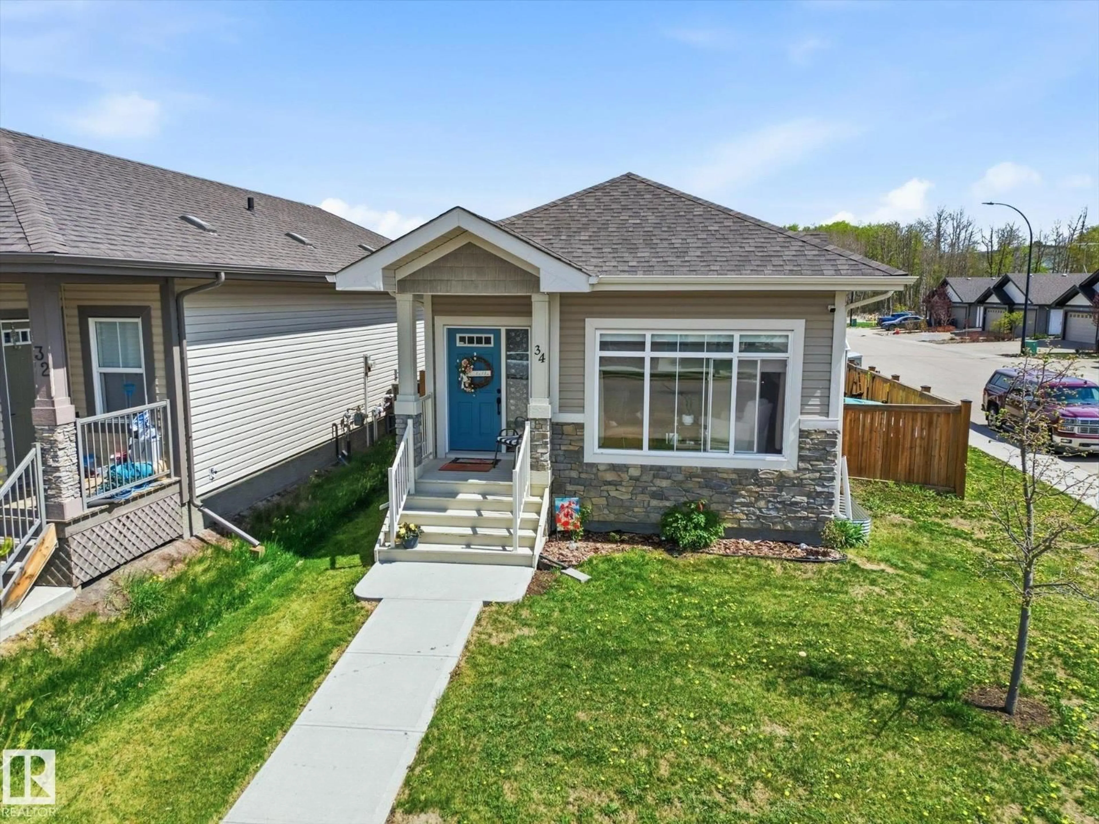 Home with brick exterior material, street for 34 BRICKYARD DR, Stony Plain Alberta T7Z0L2