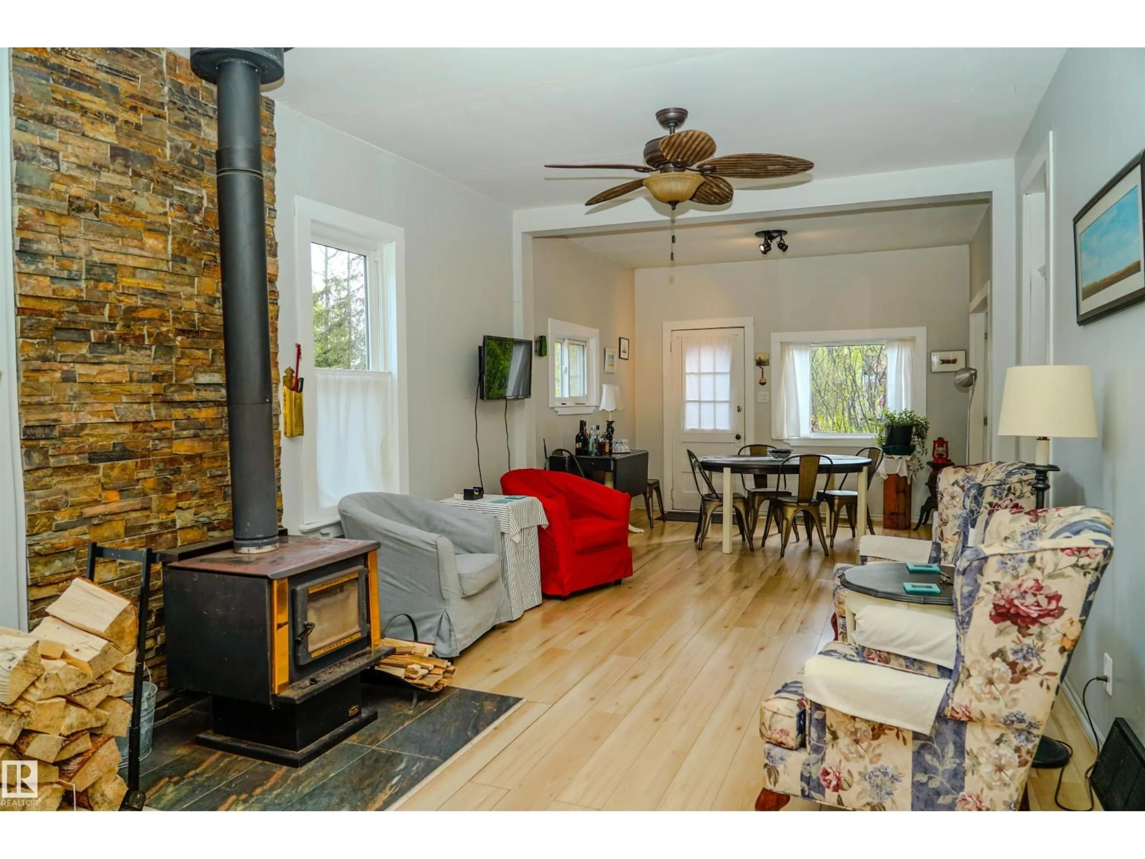 Living room with furniture, wood/laminate floor for 120 7 ST, Rural Parkland County Alberta T2B0B0