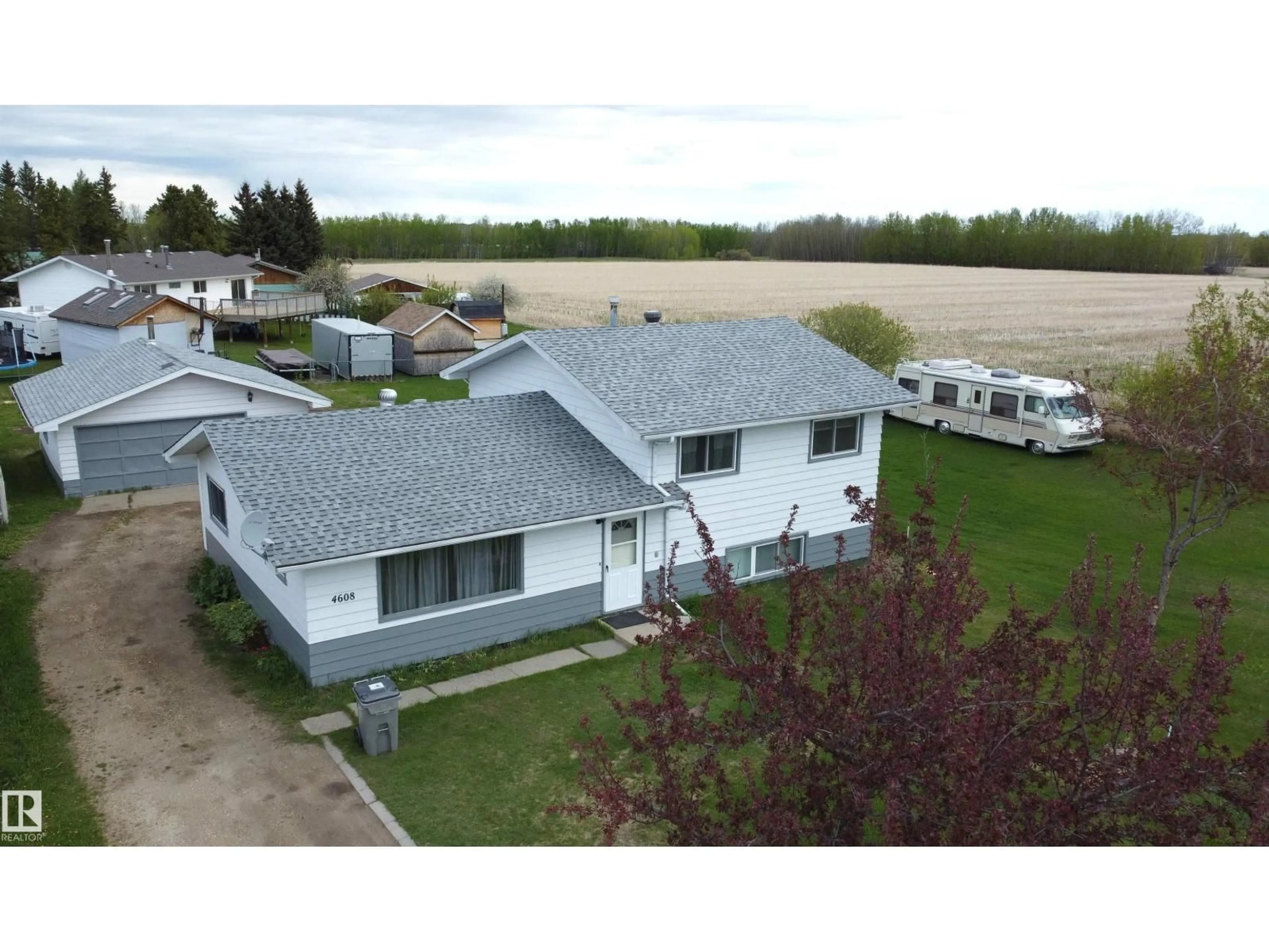 A pic from outside/outdoor area/front of a property/back of a property/a pic from drone, water/lake/river/ocean view for 4608 52 AV, Warburg Alberta T0C2T0