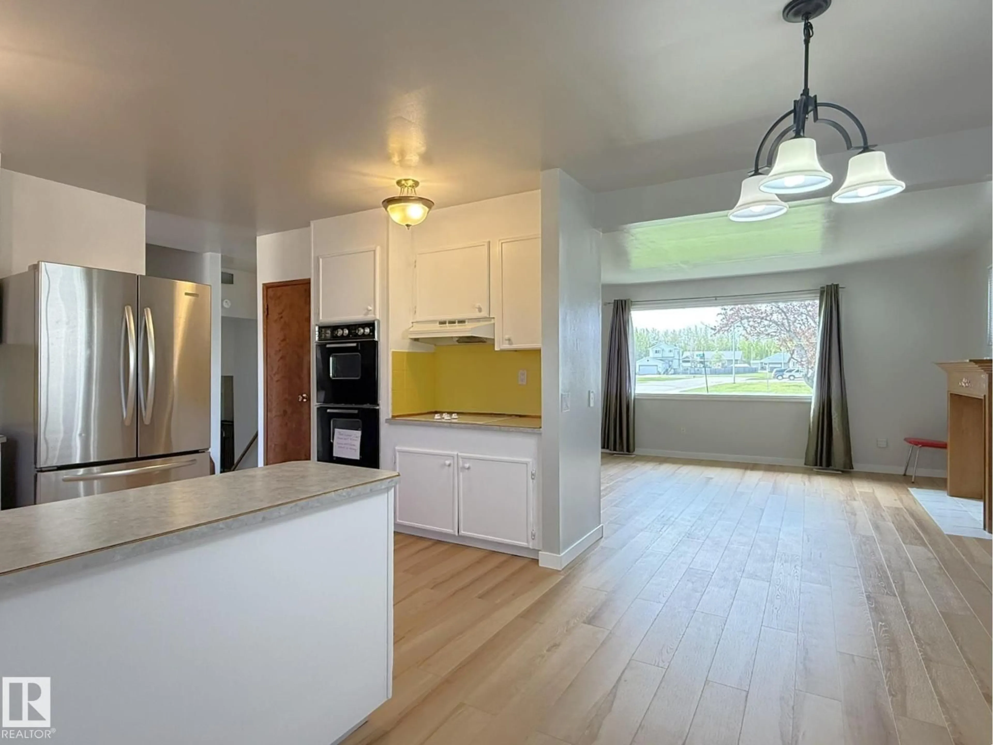 Open concept kitchen, wood/laminate floor for 4608 52 AV, Warburg Alberta T0C2T0