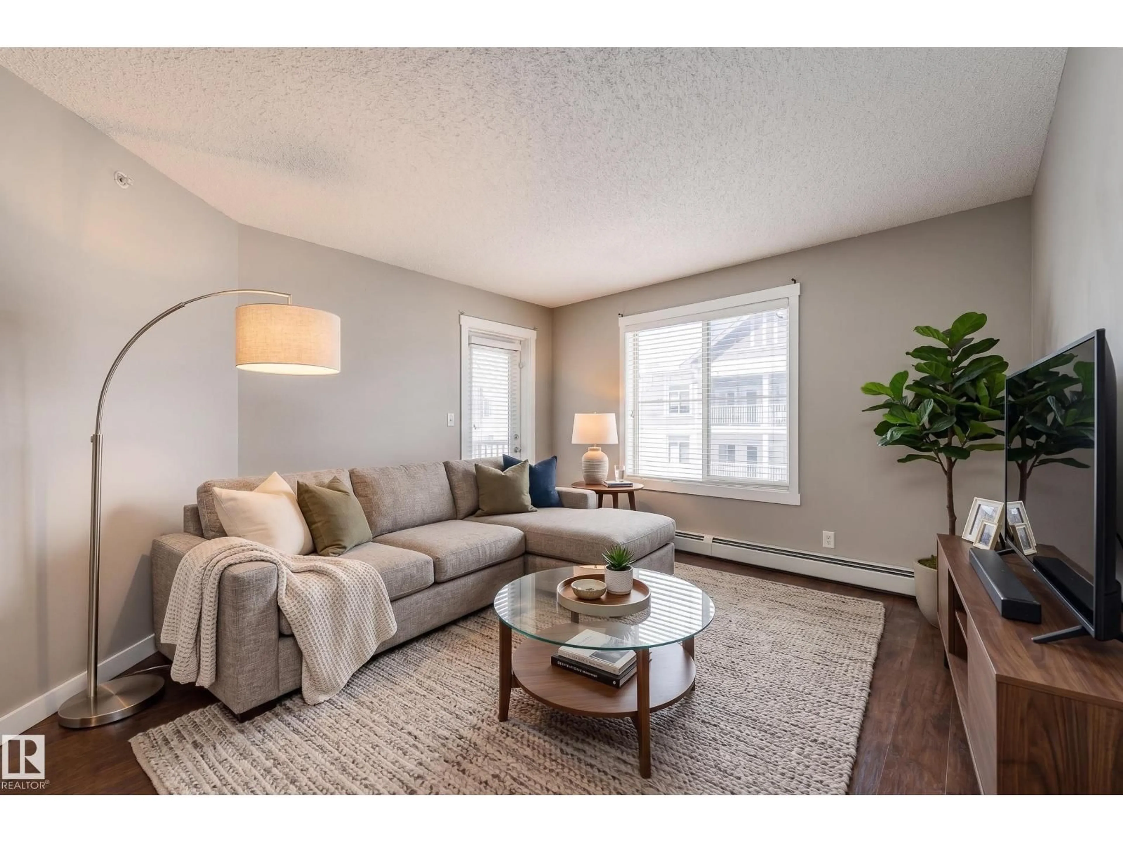 Living room with furniture, unknown for 409 - 5804 MULLEN PL, Edmonton Alberta T6R0W3