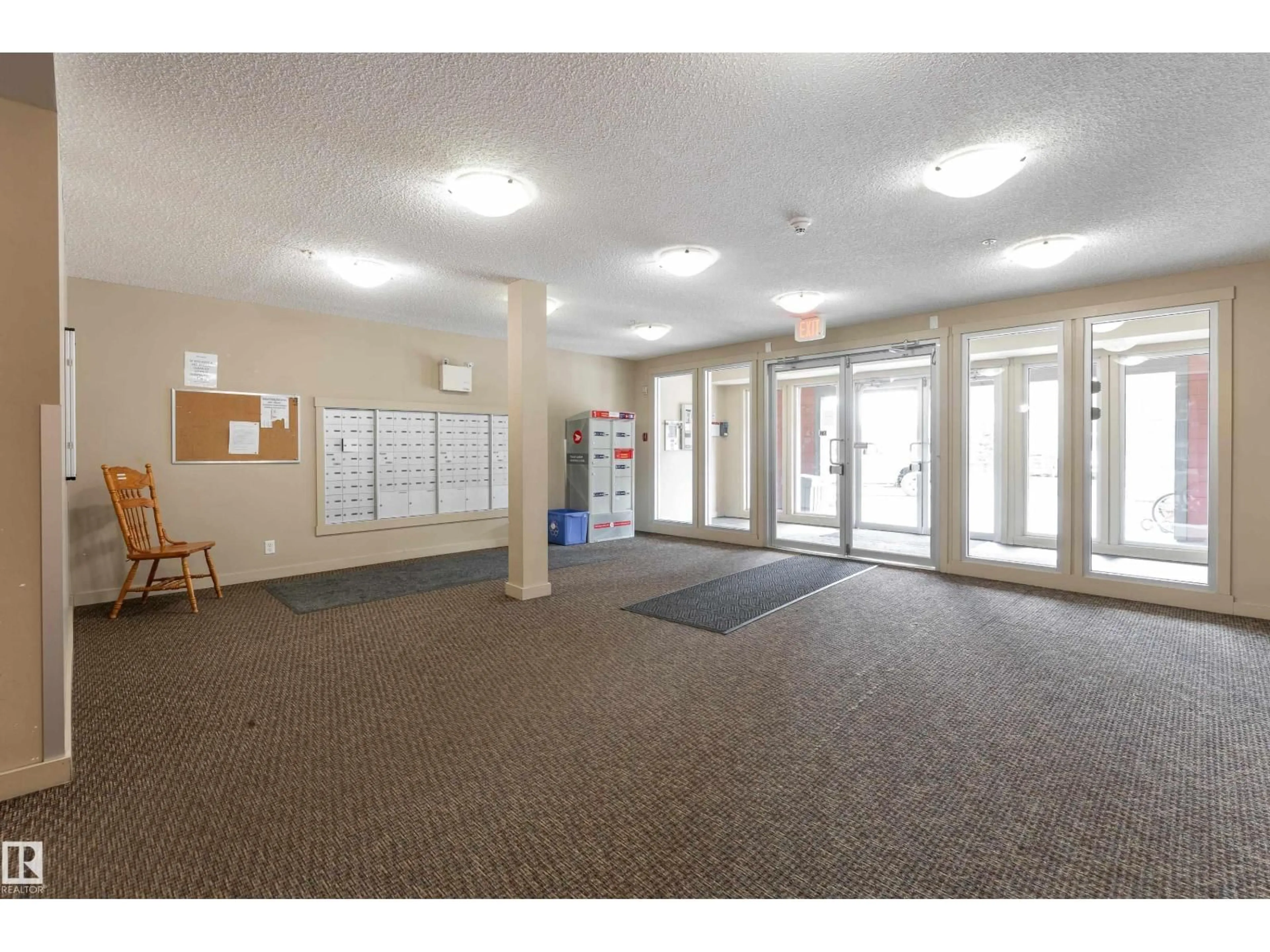 Indoor foyer for 409 - 5804 MULLEN PL, Edmonton Alberta T6R0W3